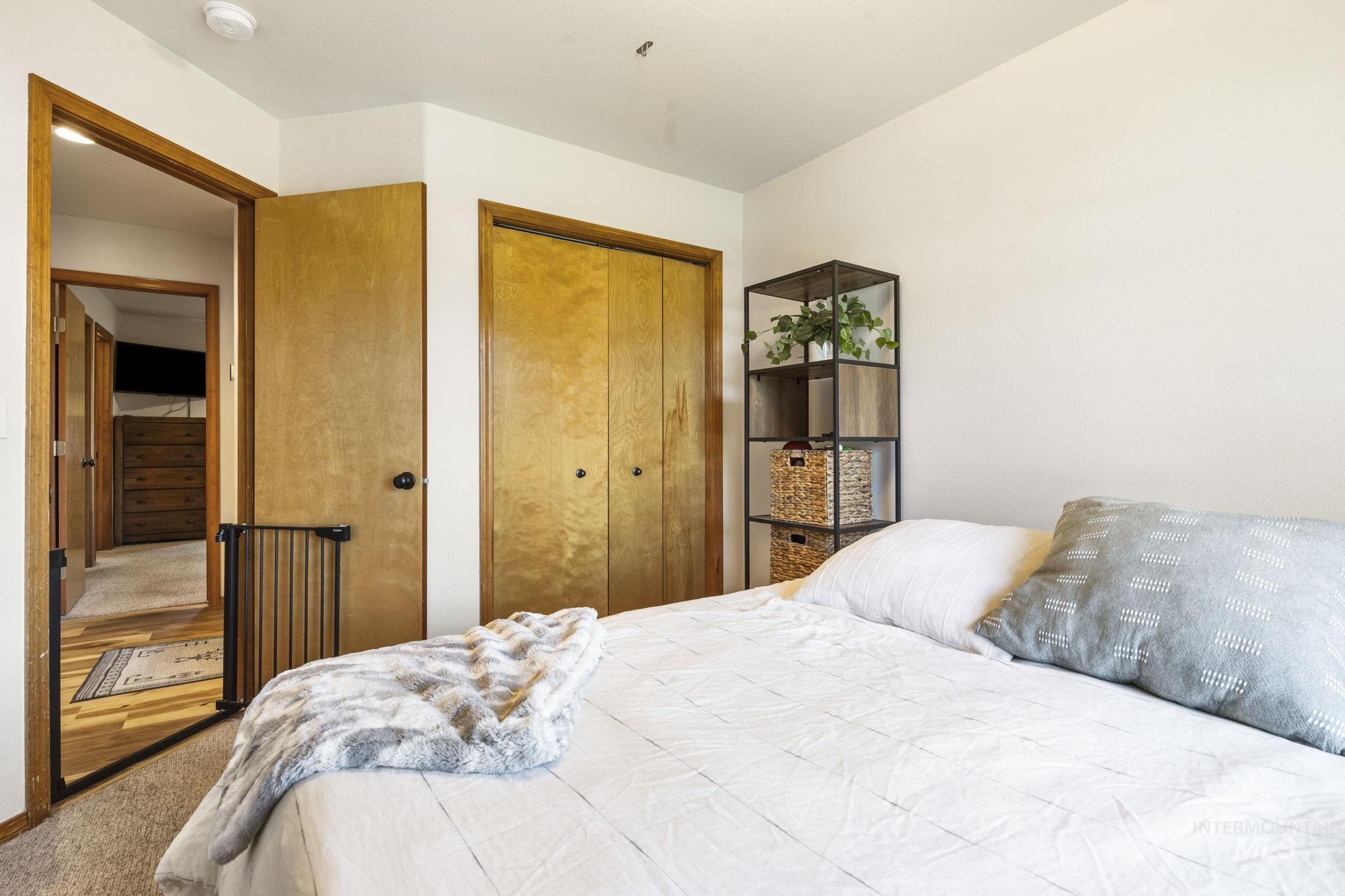 Bedroom featuring carpet floors and a closet