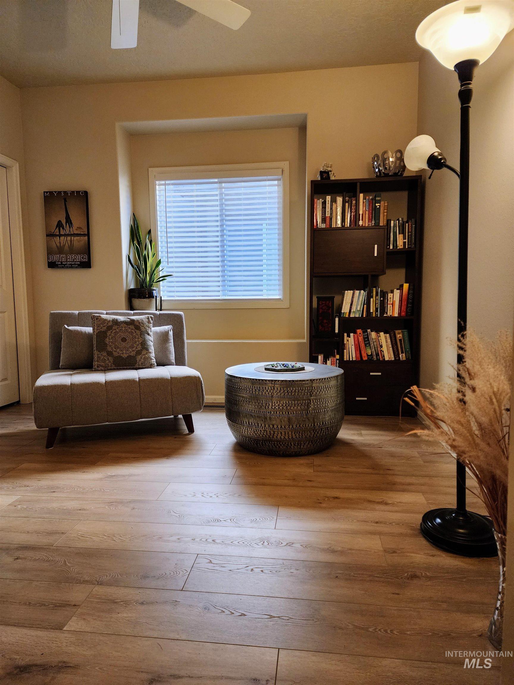 Living area featuring hardwood / wood-style flooring