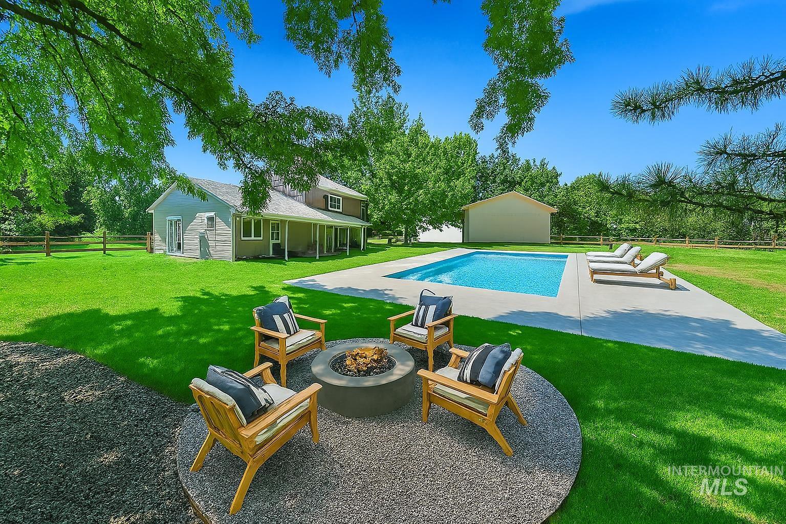 This is a rendering of what the backyard would look like with a Swimming pool and firepit.