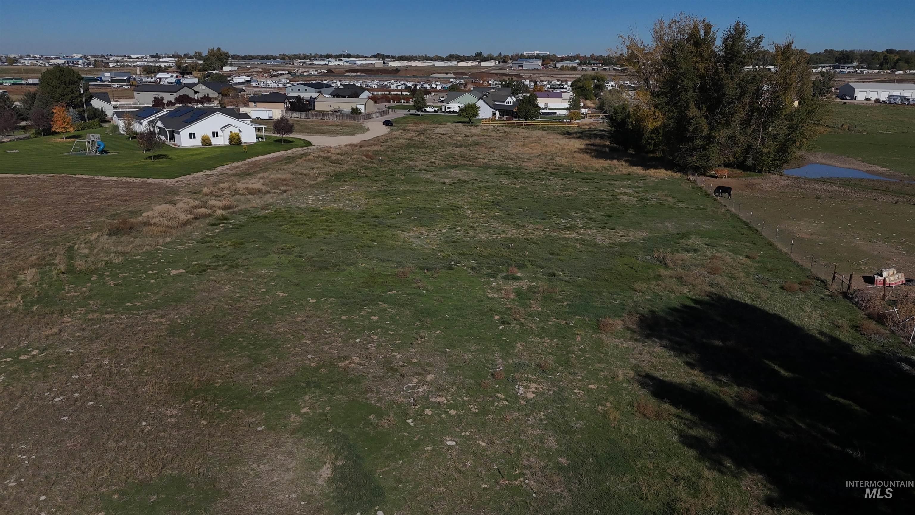 Aerial overview of property's location featuring nearby suburban area and a nearby body of water