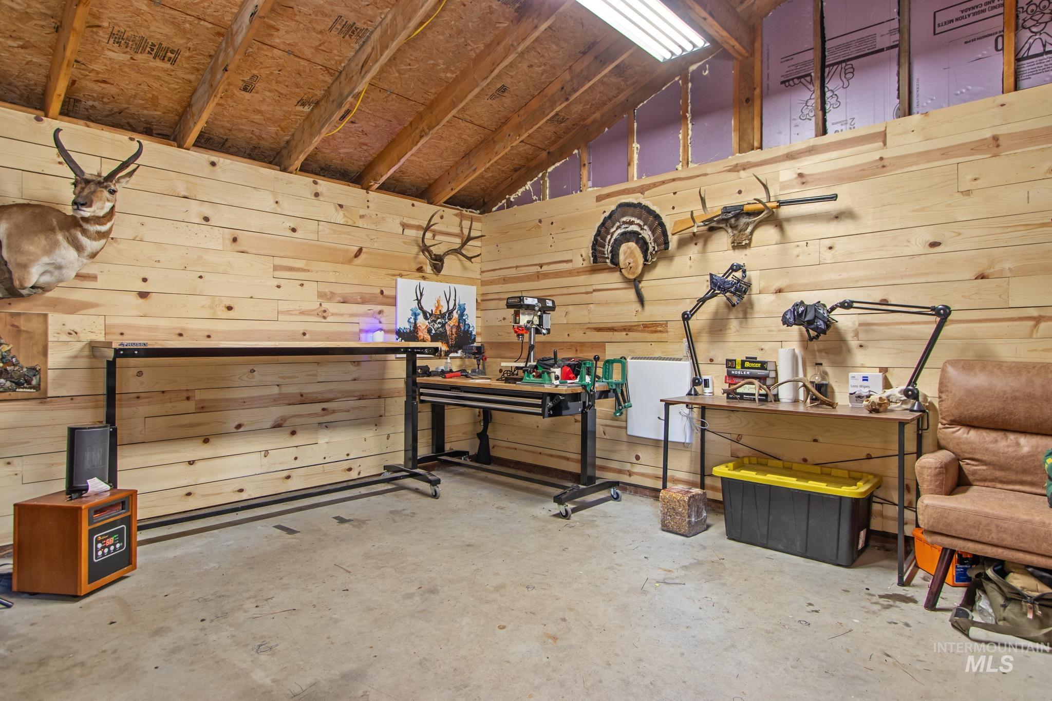 Interior space featuring a workshop area and wood walls