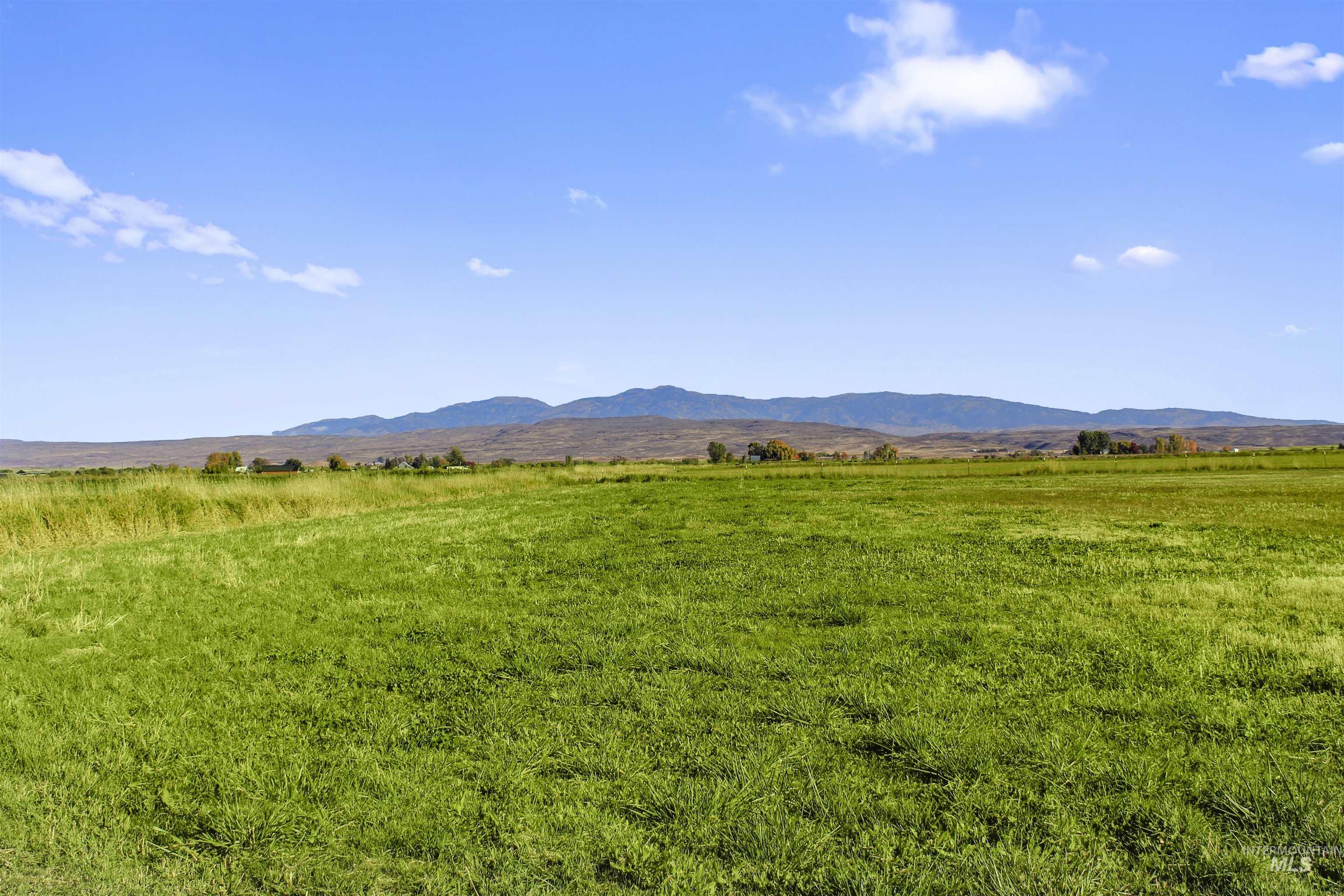 View of mountain background featuring rural landscape and a pastoral area