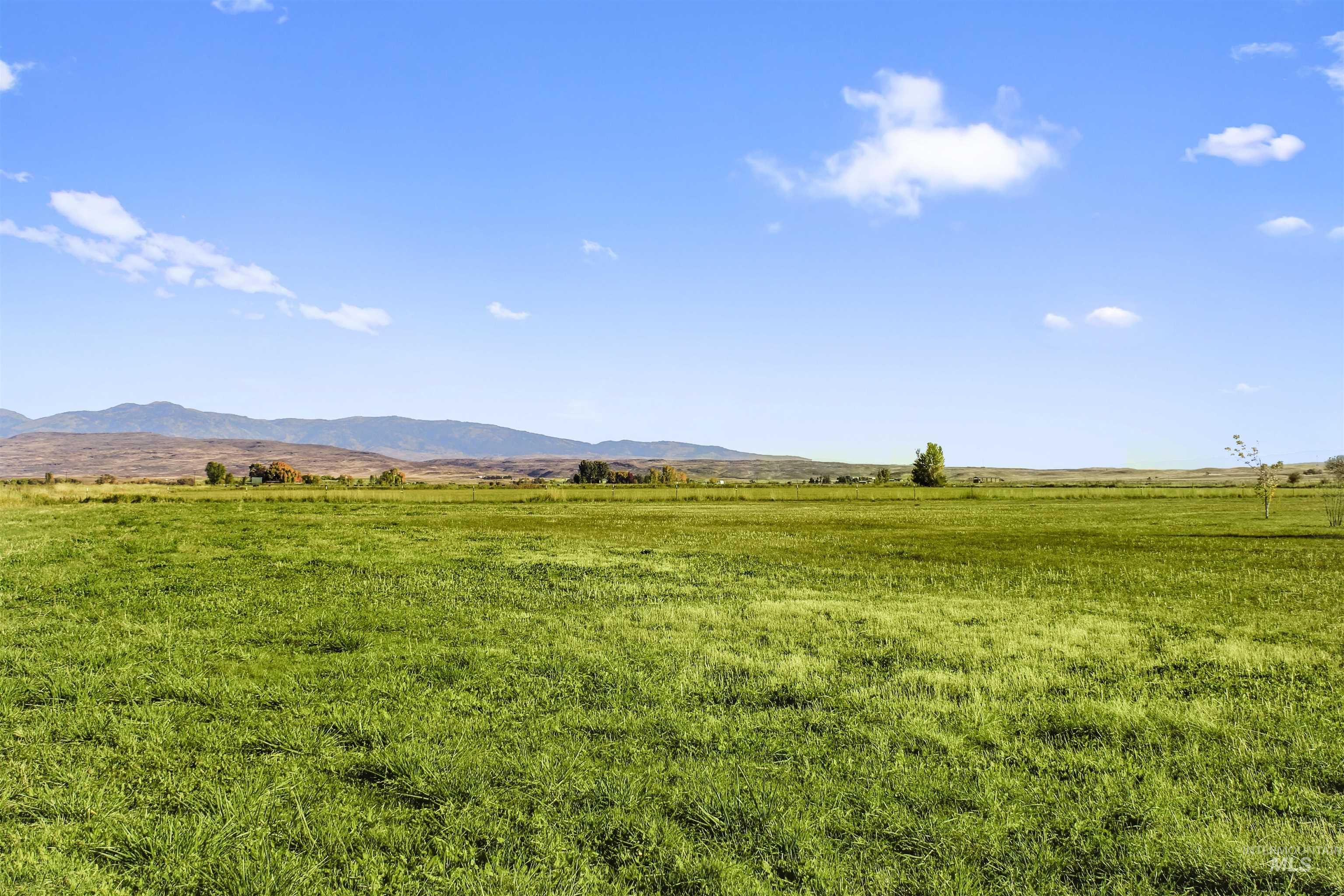 View of mountain backdrop with rural landscape
