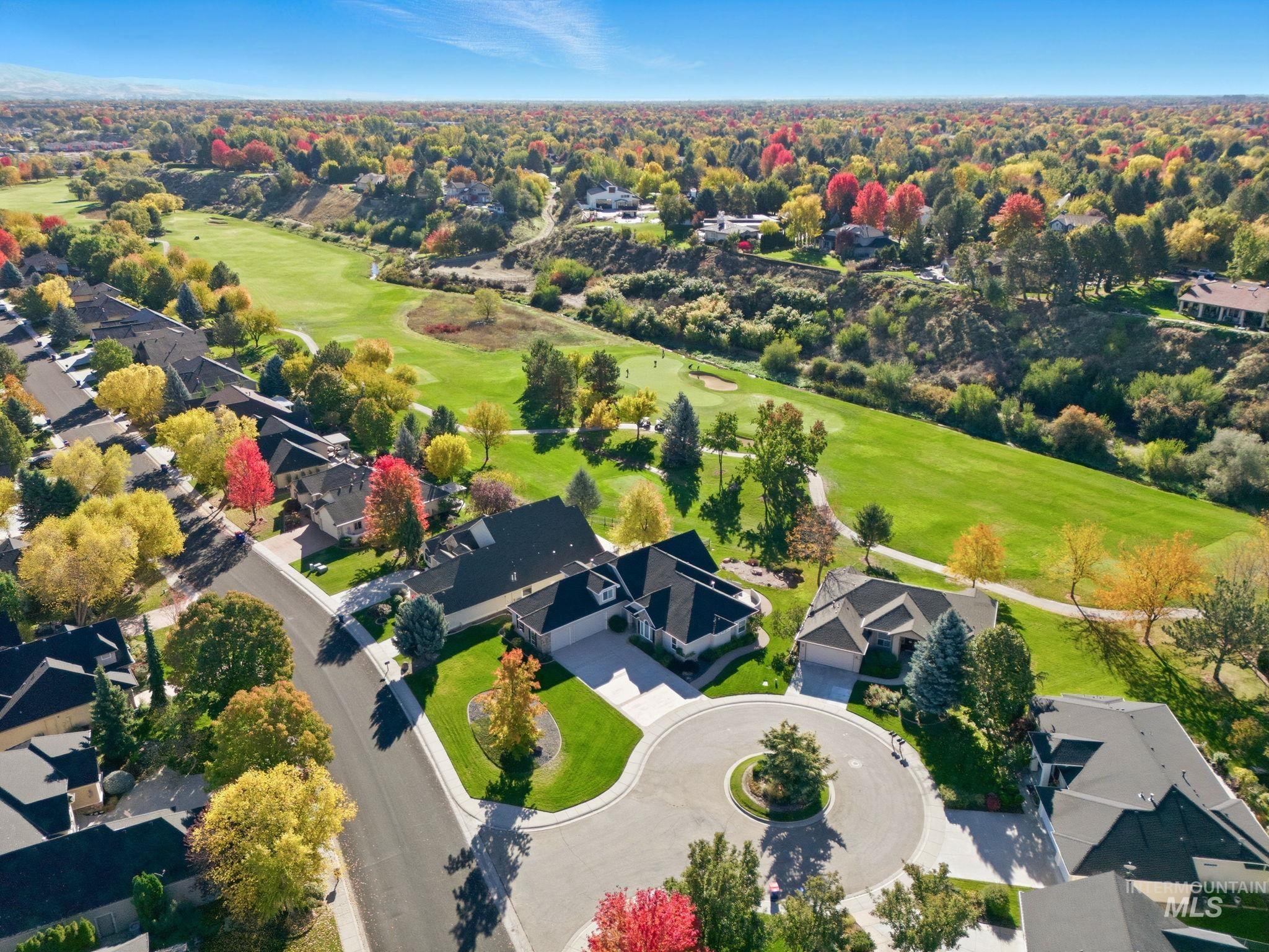 Aerial perspective of suburban area with a local golf course
