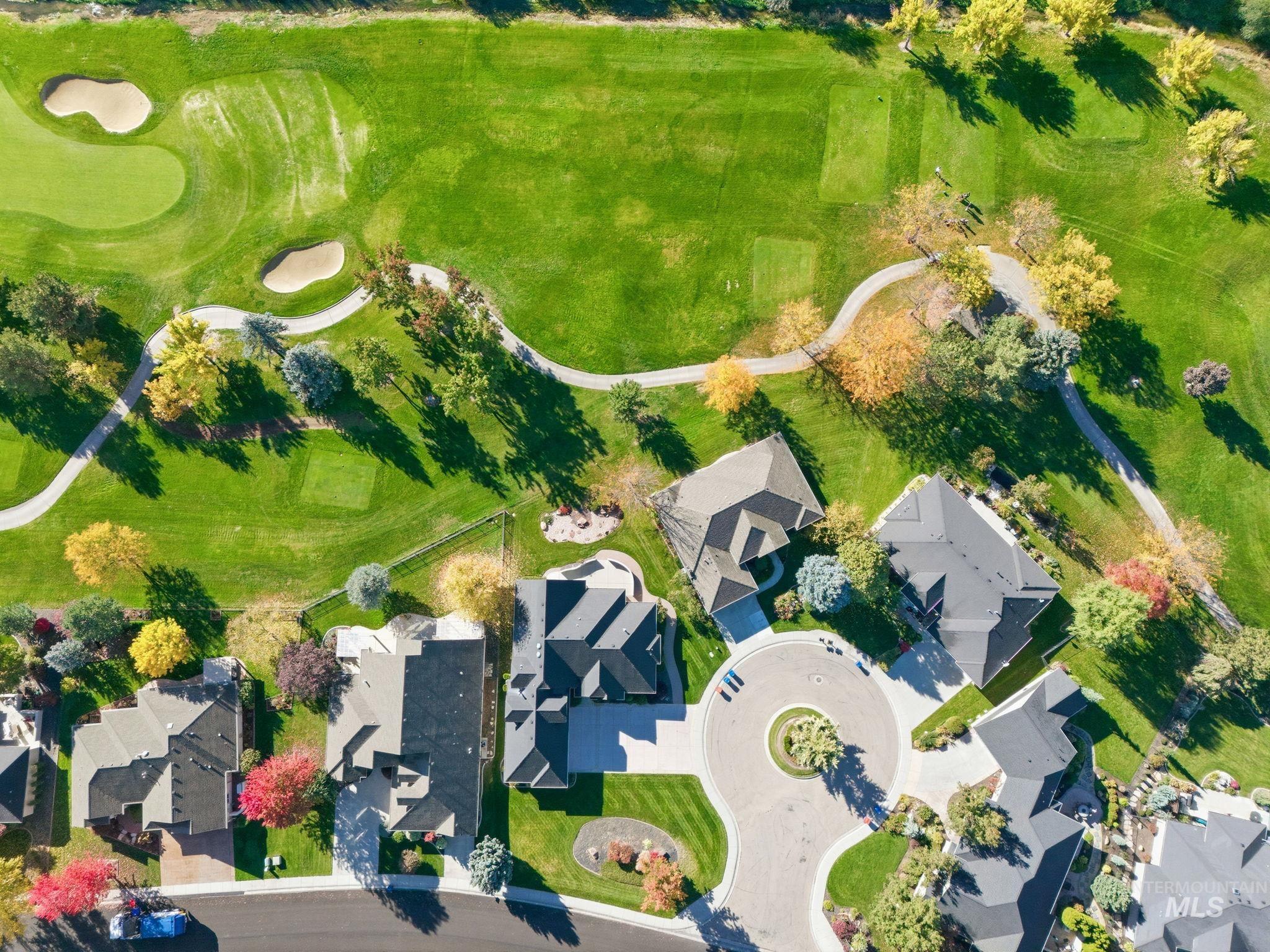 Aerial perspective of suburban area with a golf club