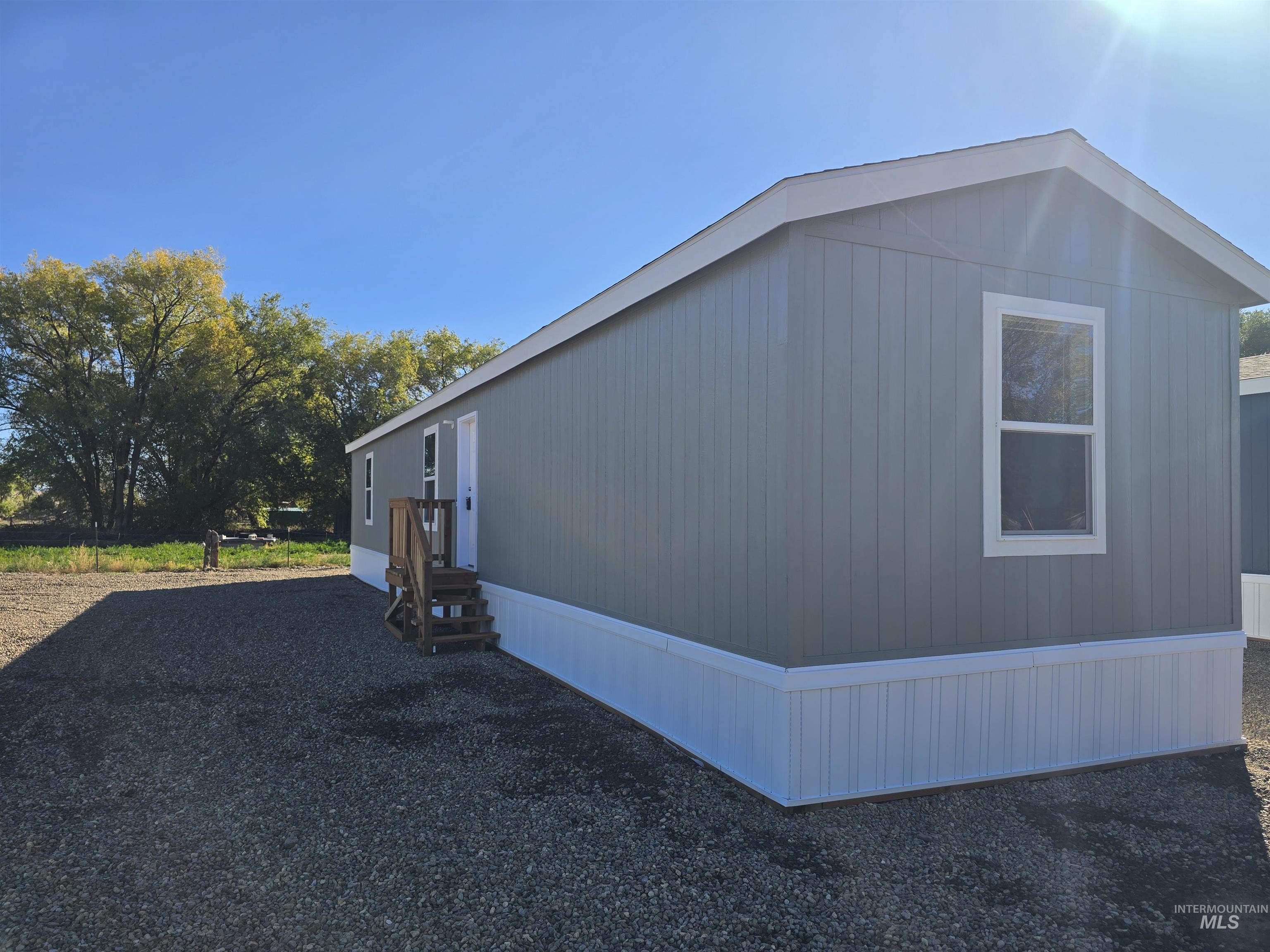 View of side of home with entry steps