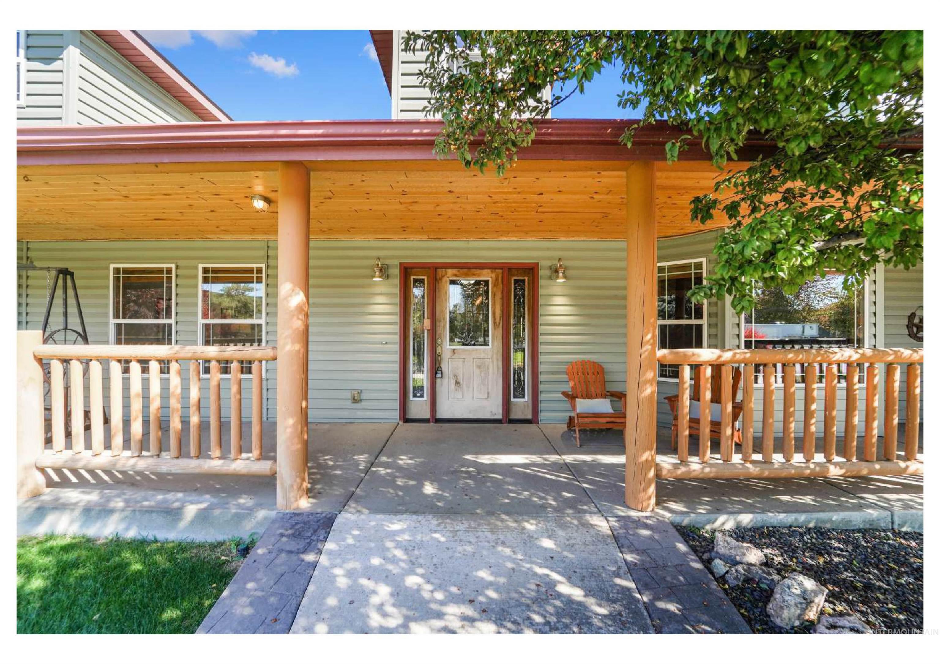 Doorway to property with covered porch