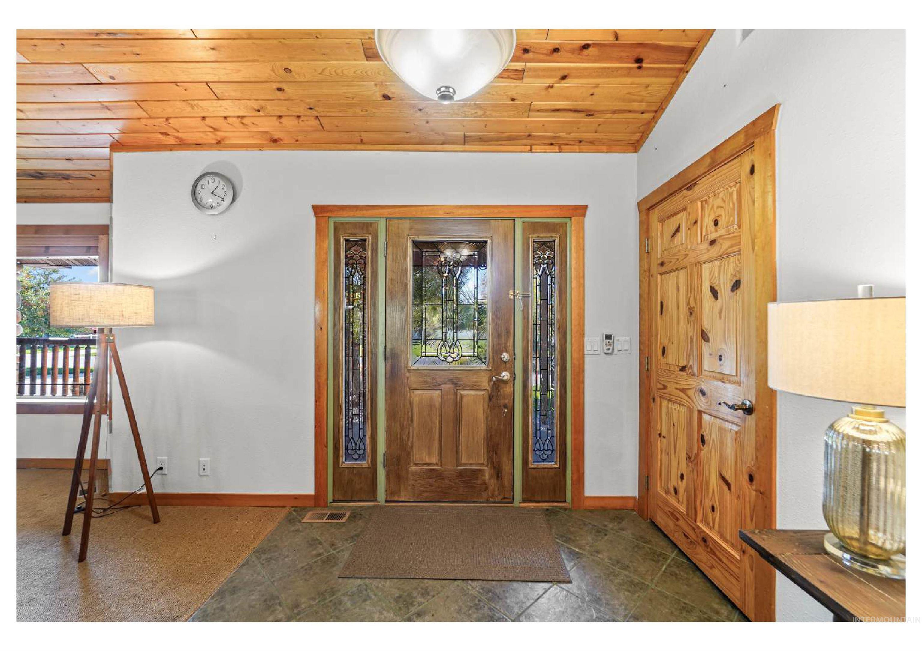 Entryway with wooden ceiling and plenty of natural light