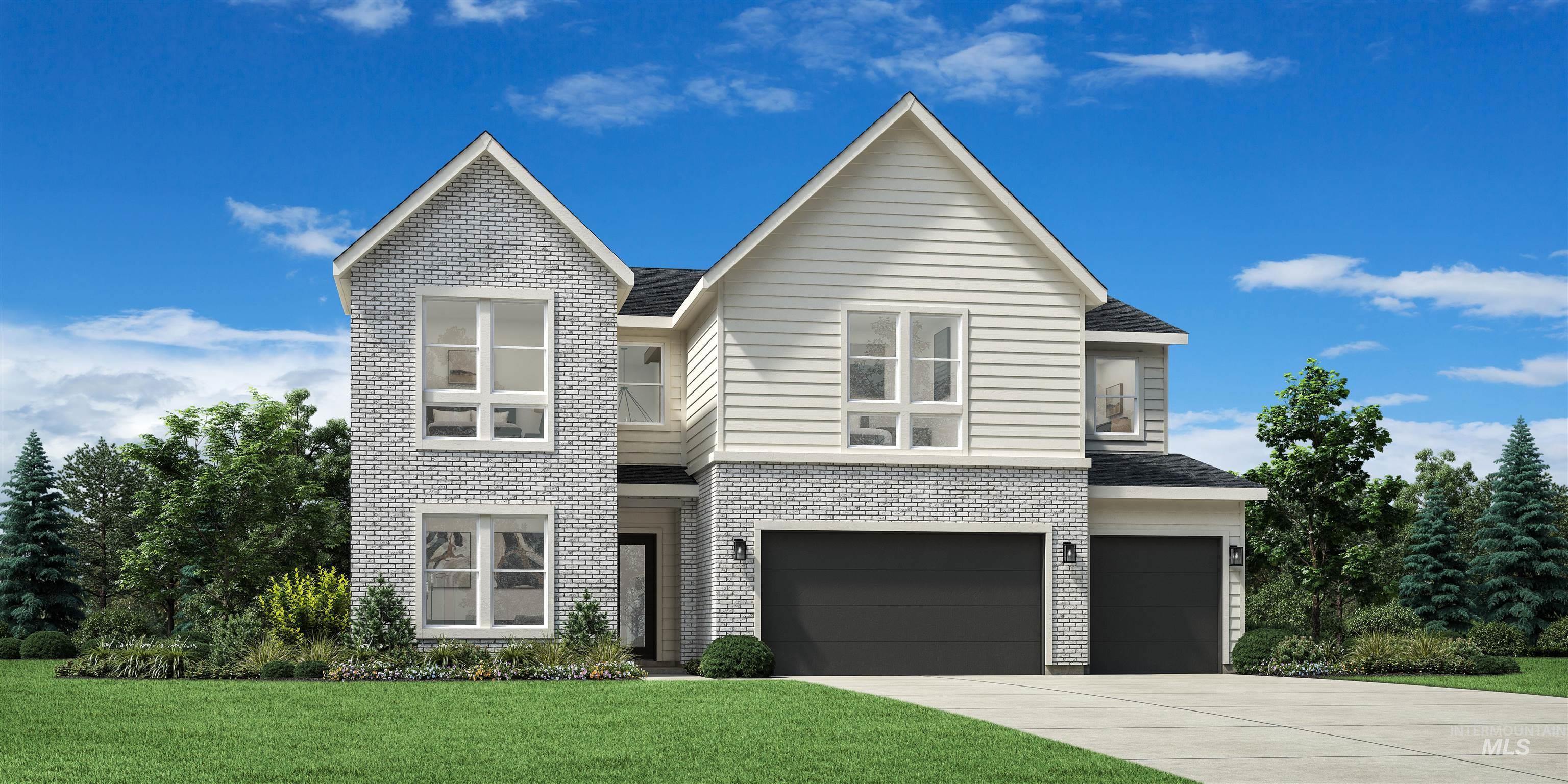View of front facade featuring an attached garage, a front lawn, driveway, and brick siding