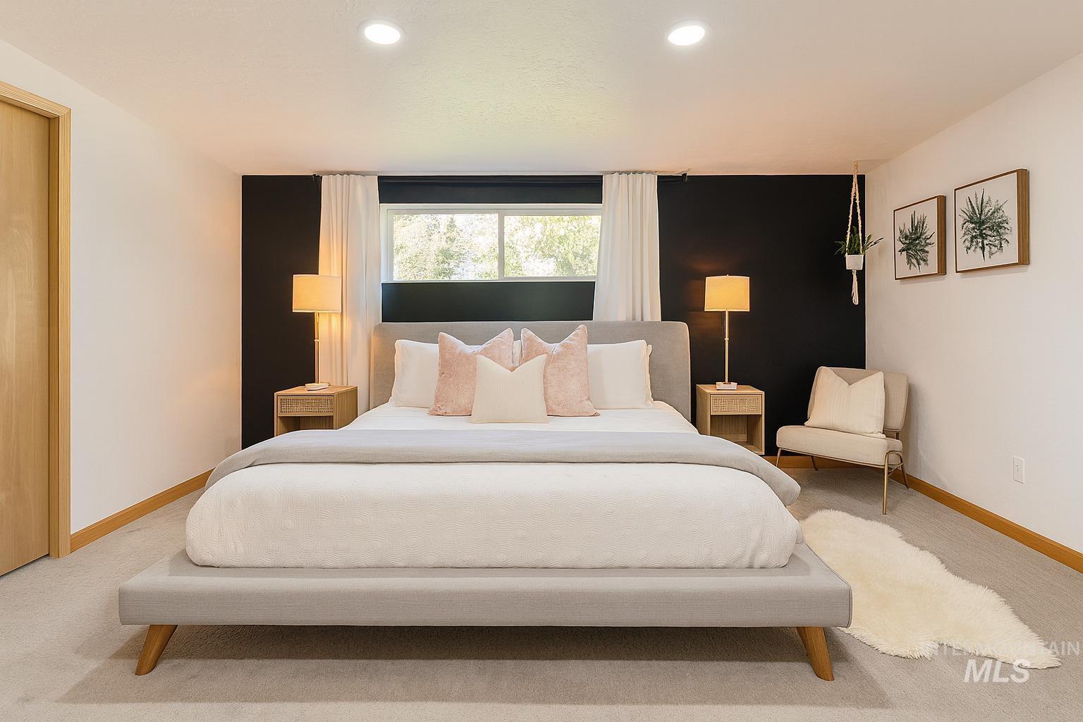 Carpeted bedroom with baseboards and recessed lighting