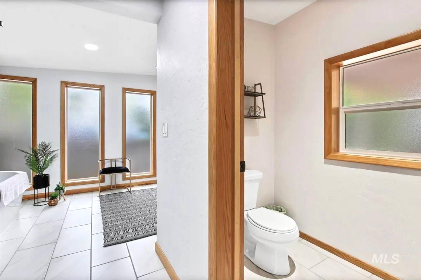Bathroom with tile patterned flooring and recessed lighting