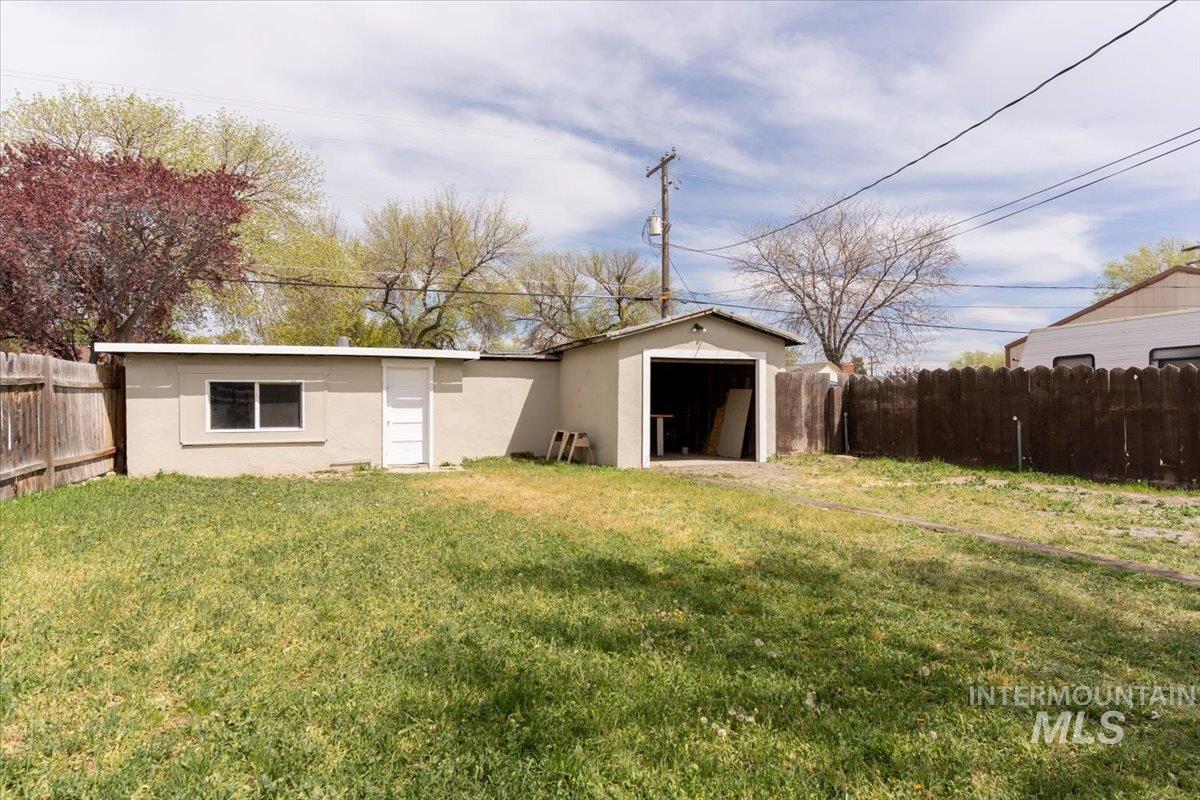 View of outbuilding featuring a fenced backyard