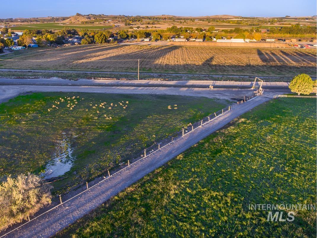 Overview of rural landscape featuring rows of crops