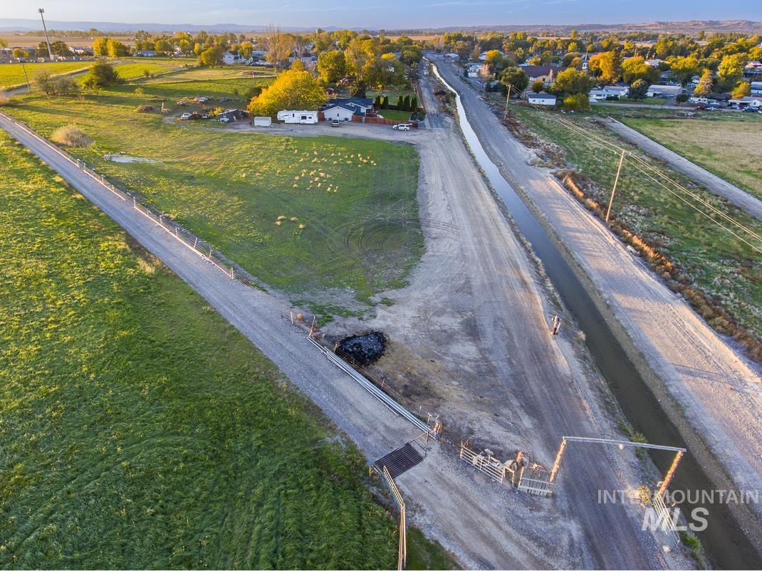 Aerial view of property and surrounding area featuring rural landscape