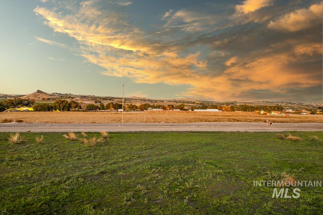 View of grassy yard featuring a view of rural / pastoral area