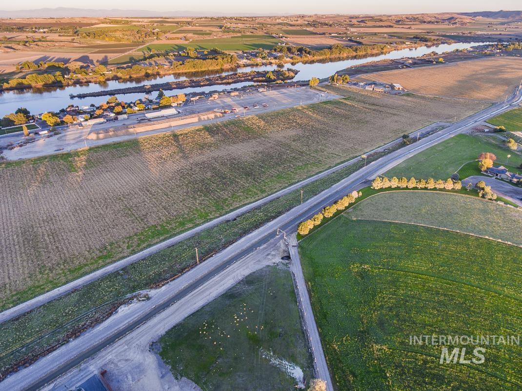 View of property location with rural landscape, a nearby body of water, and extensive farmland