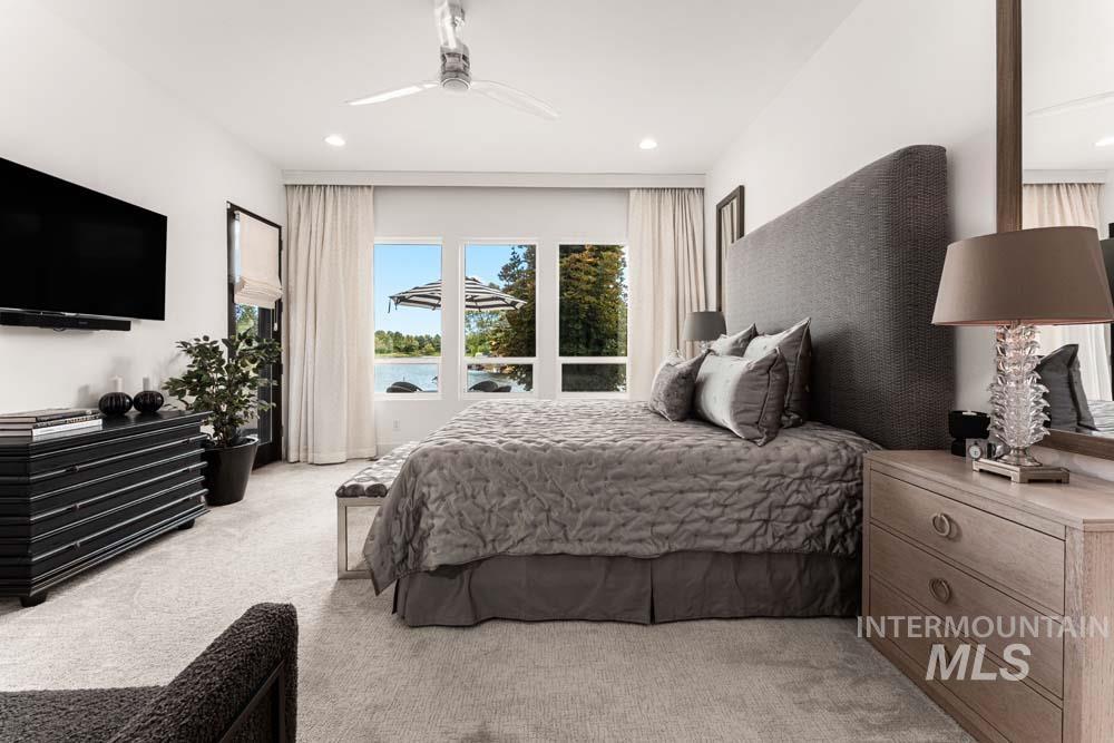 Bedroom featuring light colored carpet, access to exterior, recessed lighting, and ceiling fan