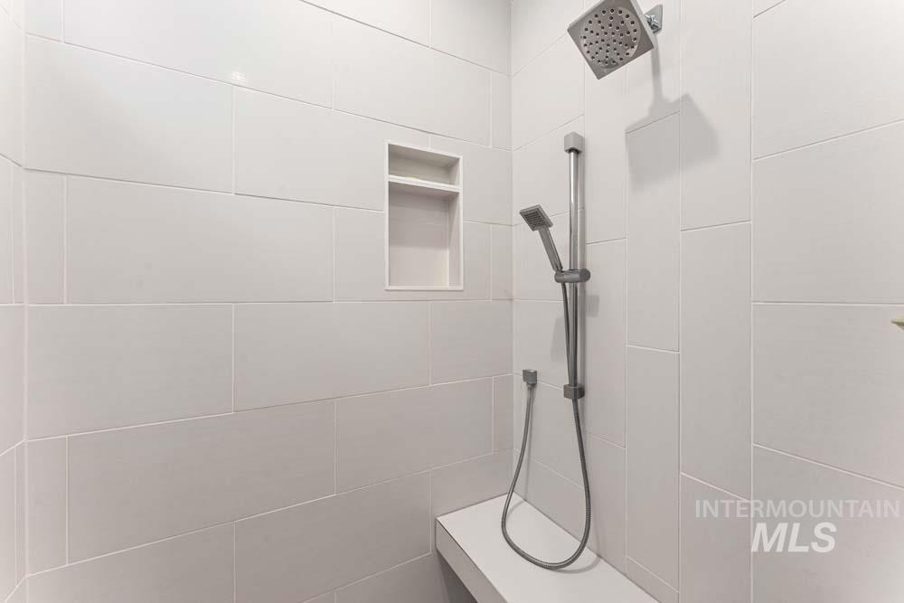 Full bath with a tile shower