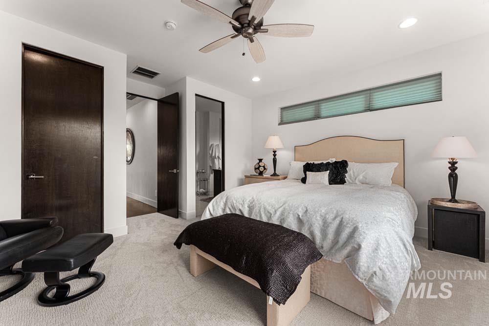 Bedroom with carpet, recessed lighting, and a ceiling fan
