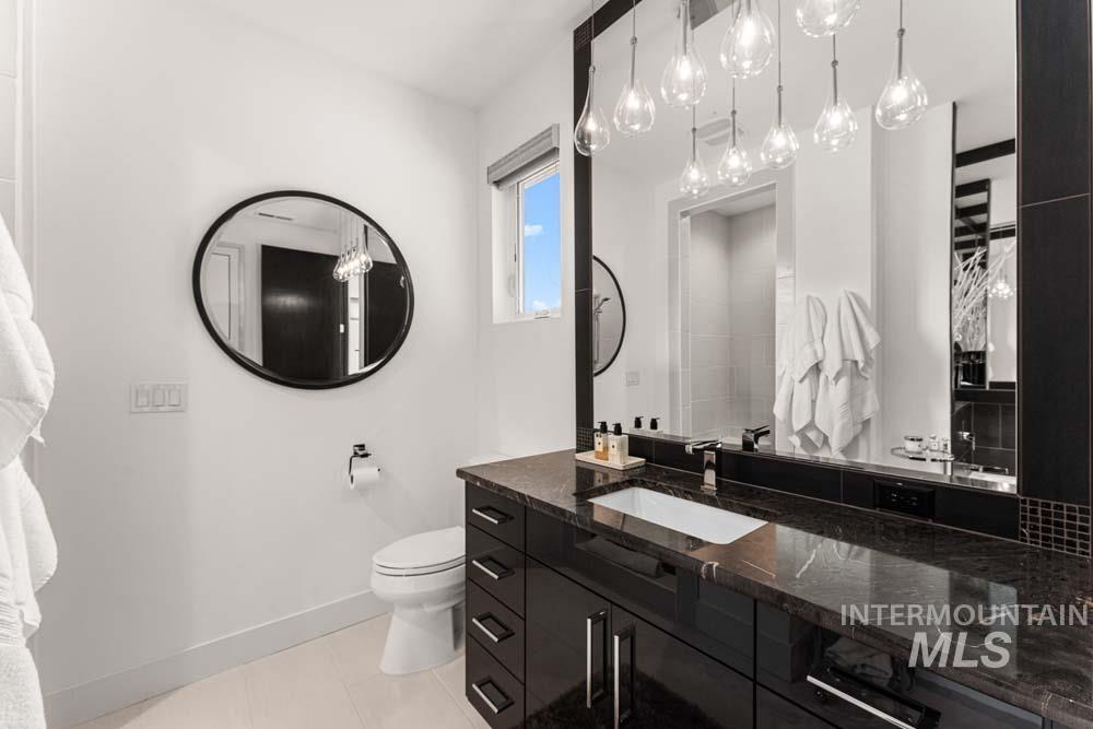 Bathroom with vanity and tile patterned flooring