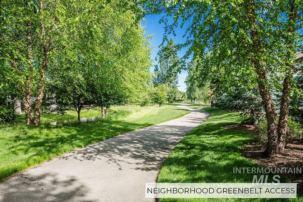 View of property's community featuring a yard
