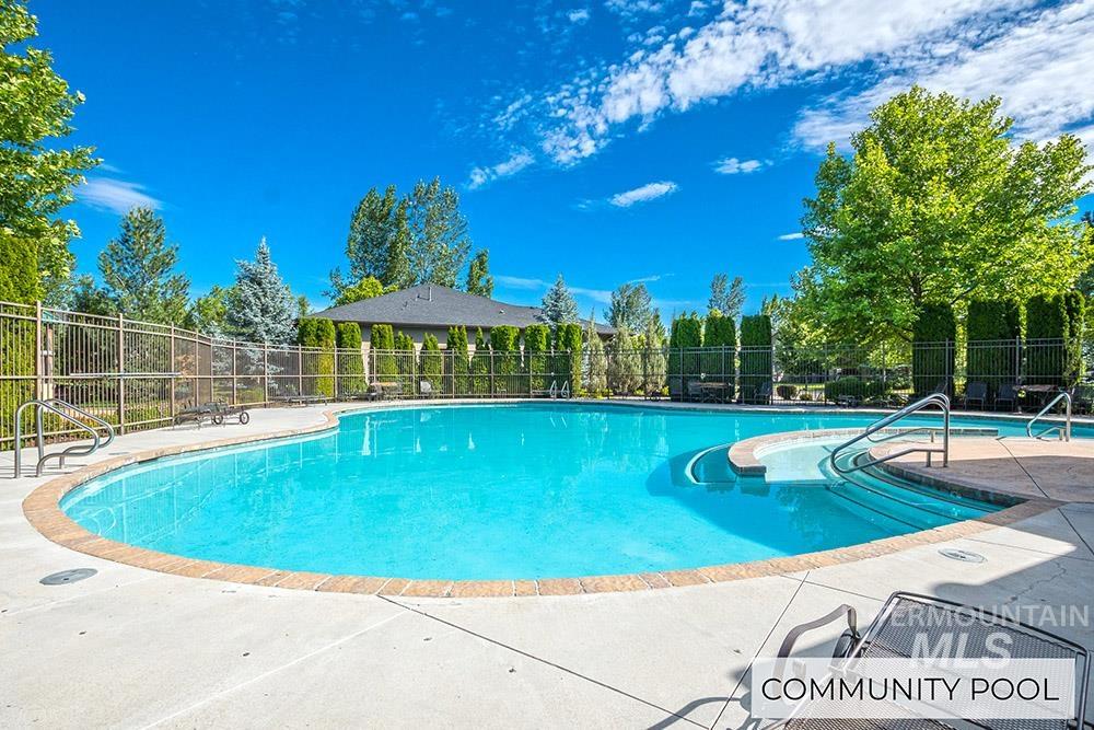 Community pool with a patio