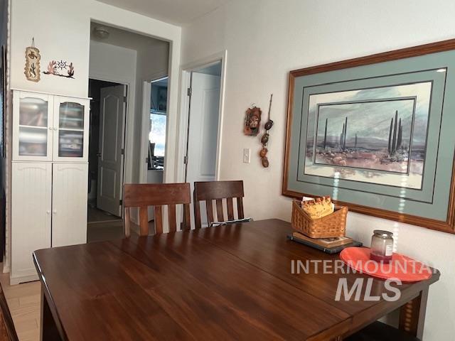 Dining space with light wood-style flooring