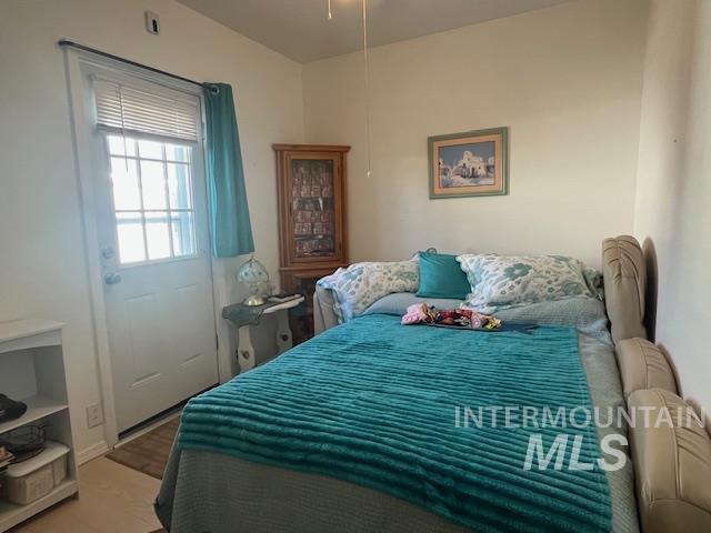 Bedroom with wood finished floors