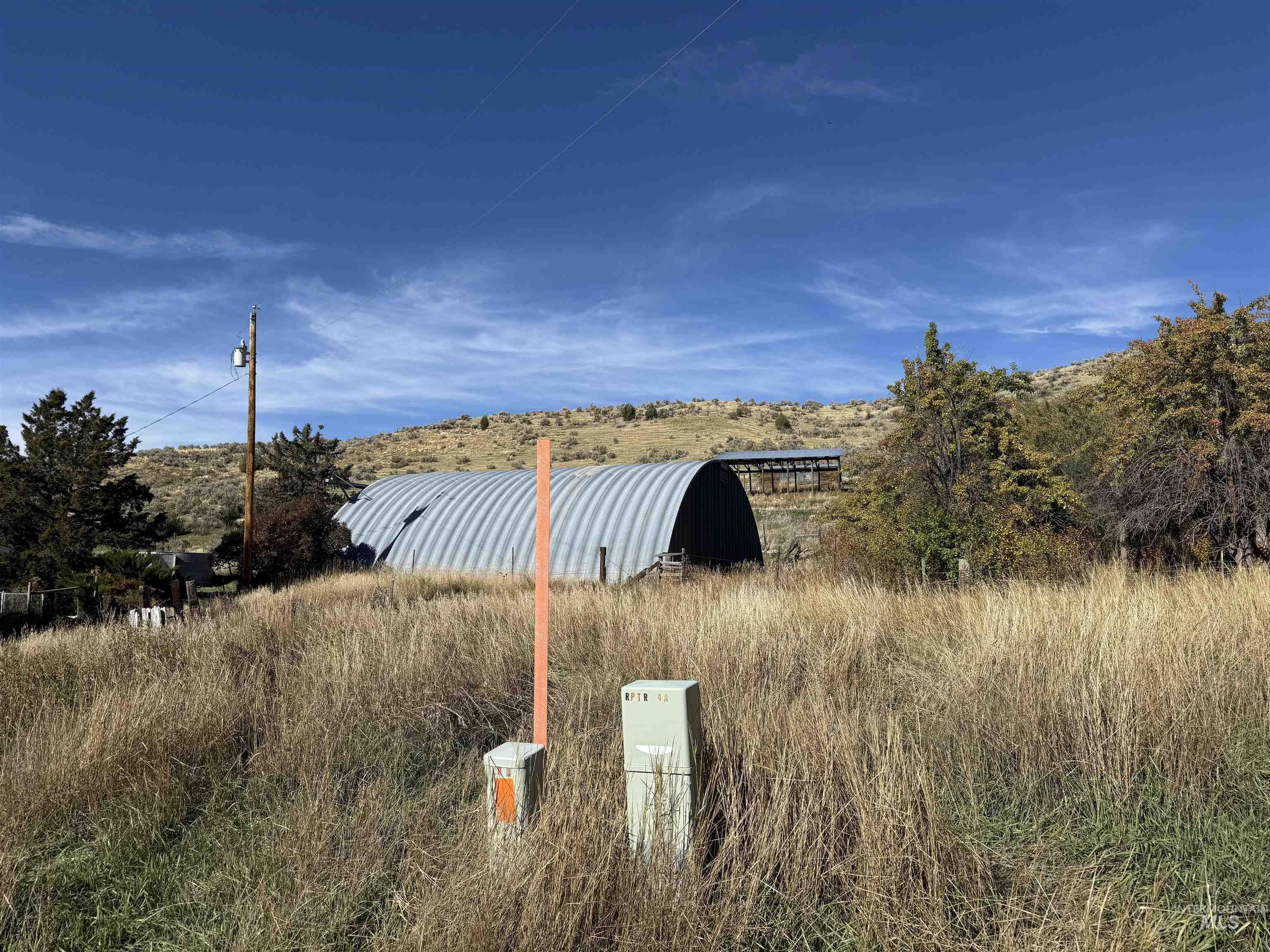 Water view featuring an outbuilding and rural landscape