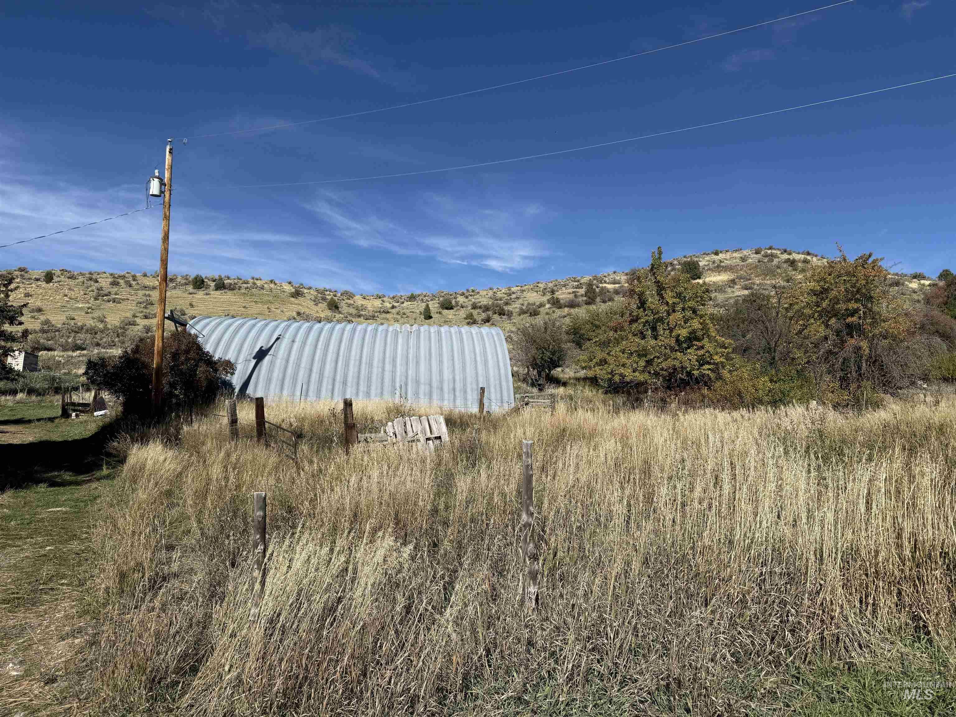 View of yard with a mountain view and an outbuilding