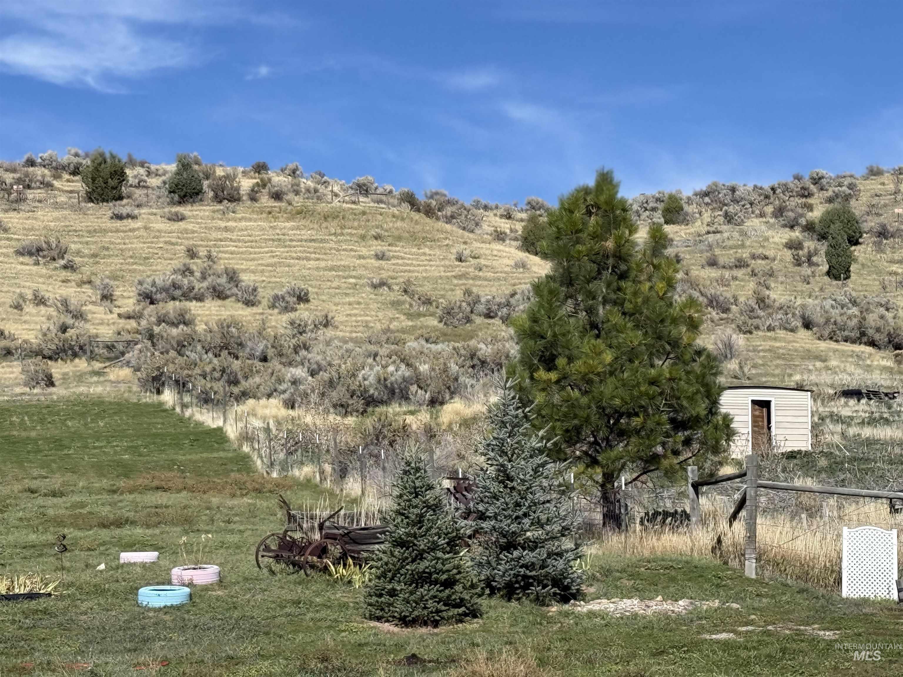 View of green lawn featuring a rural view