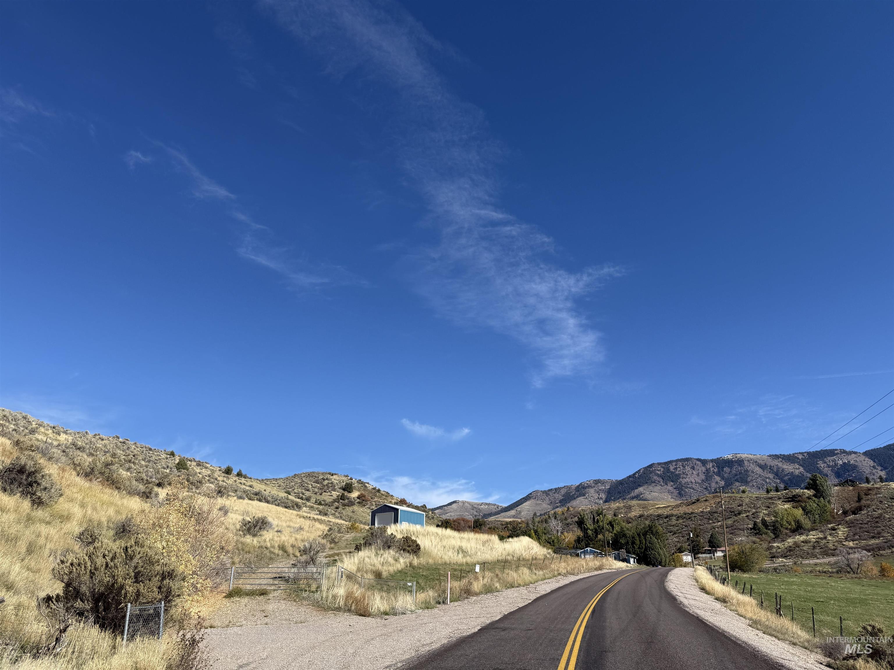 View of asphalt road featuring a mountain view
