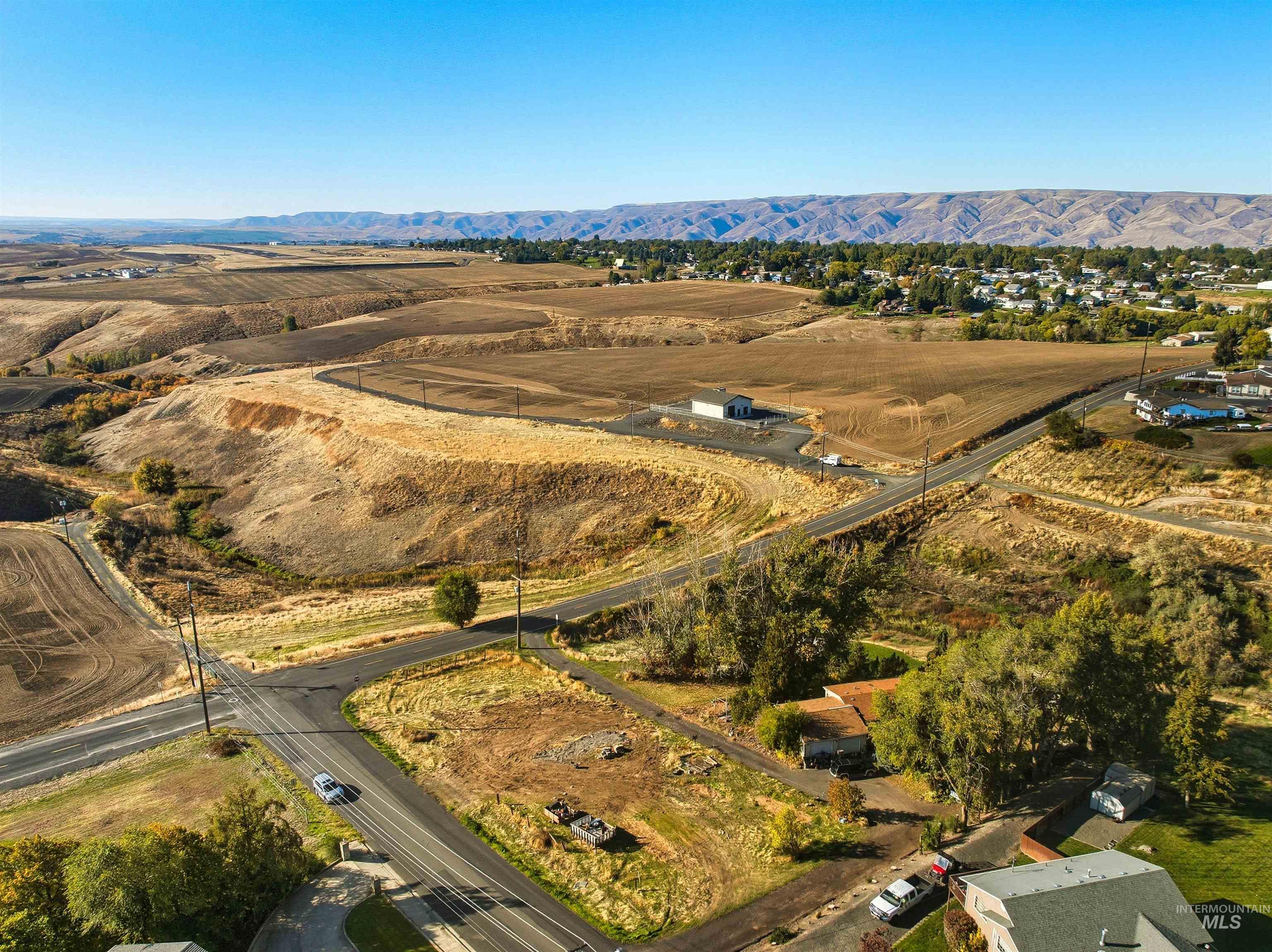 View of property location with a mountainous background and rural landscape