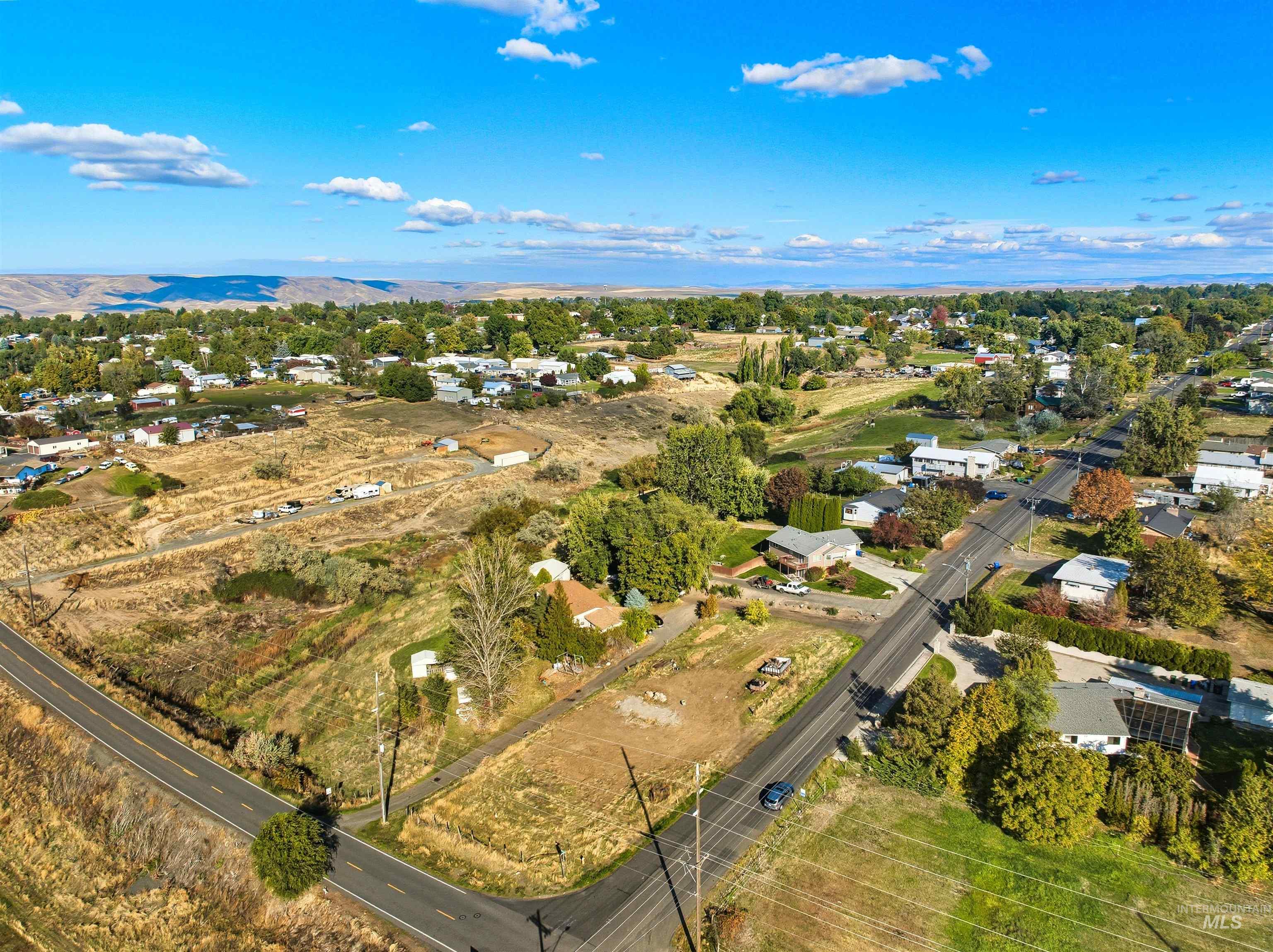 Aerial overview of property's location featuring nearby suburban area