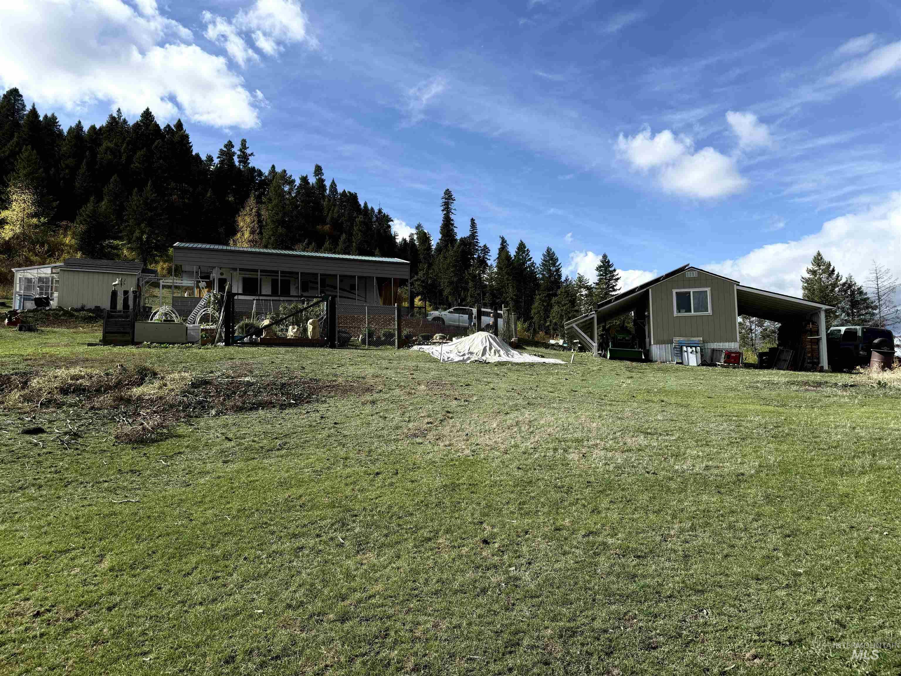 Property layout with RV canopy solar house & utility shed