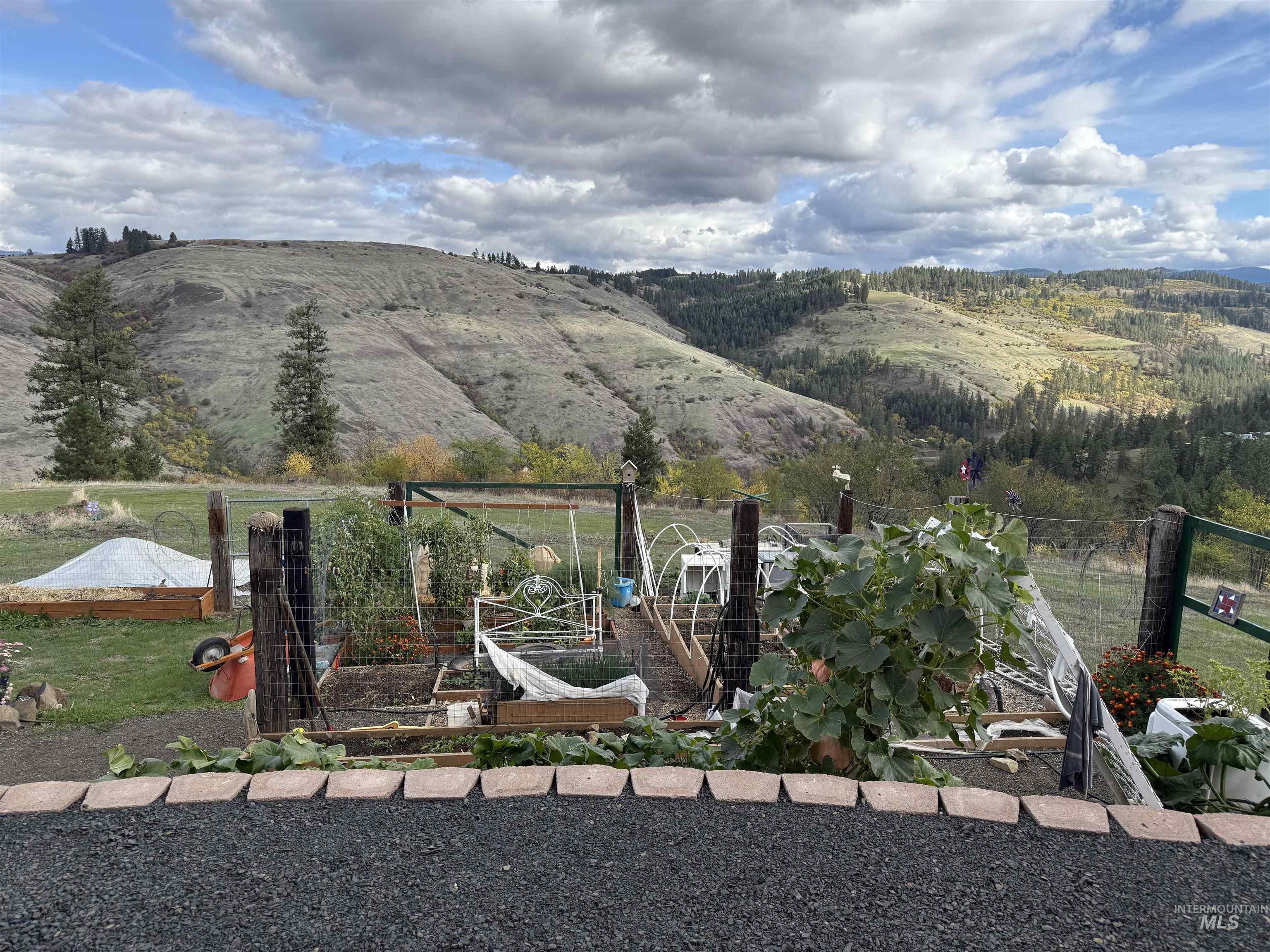 Gravel patio area overlooking garden and the view of mountains