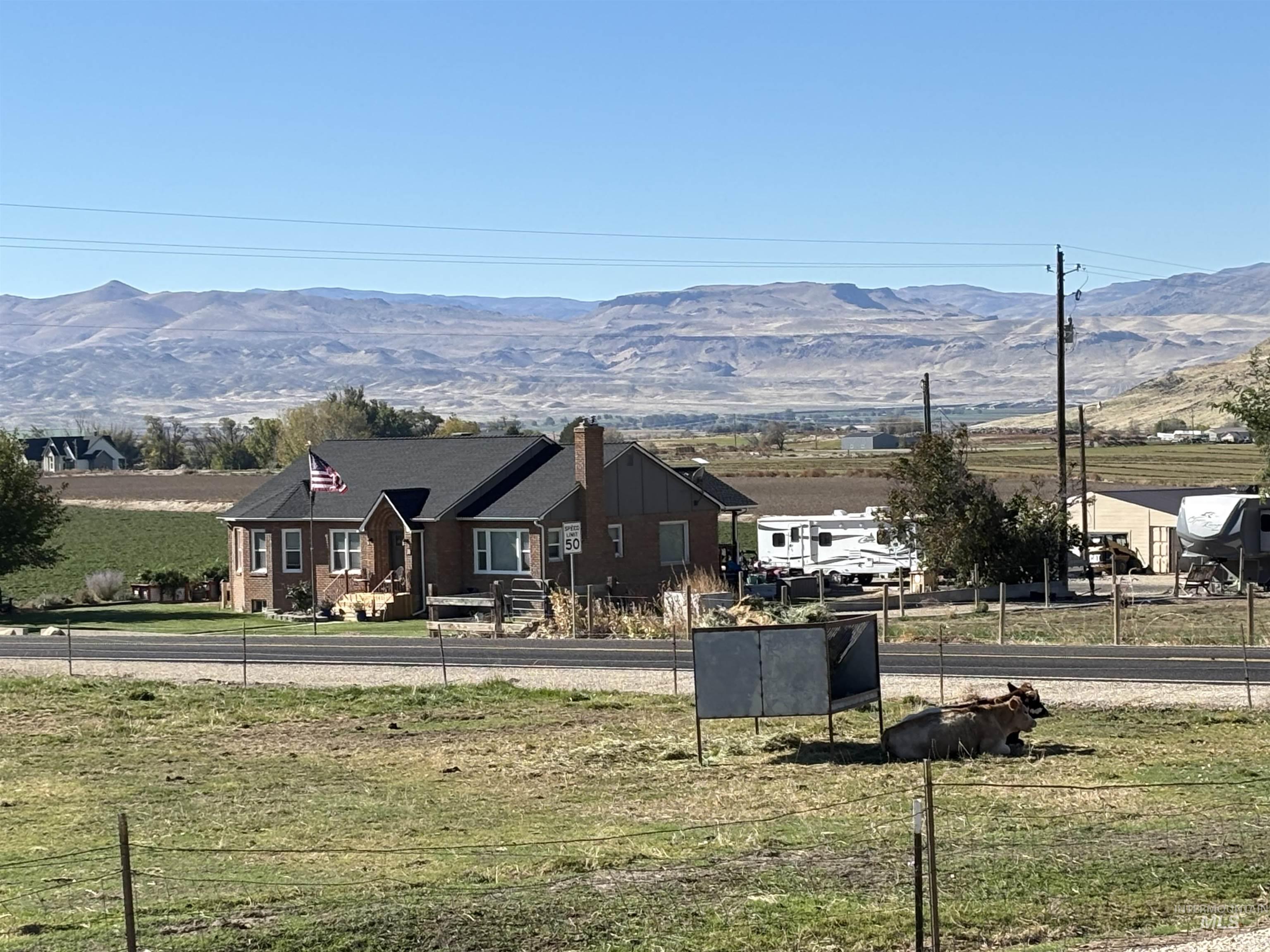 View of mountain background featuring rural landscape