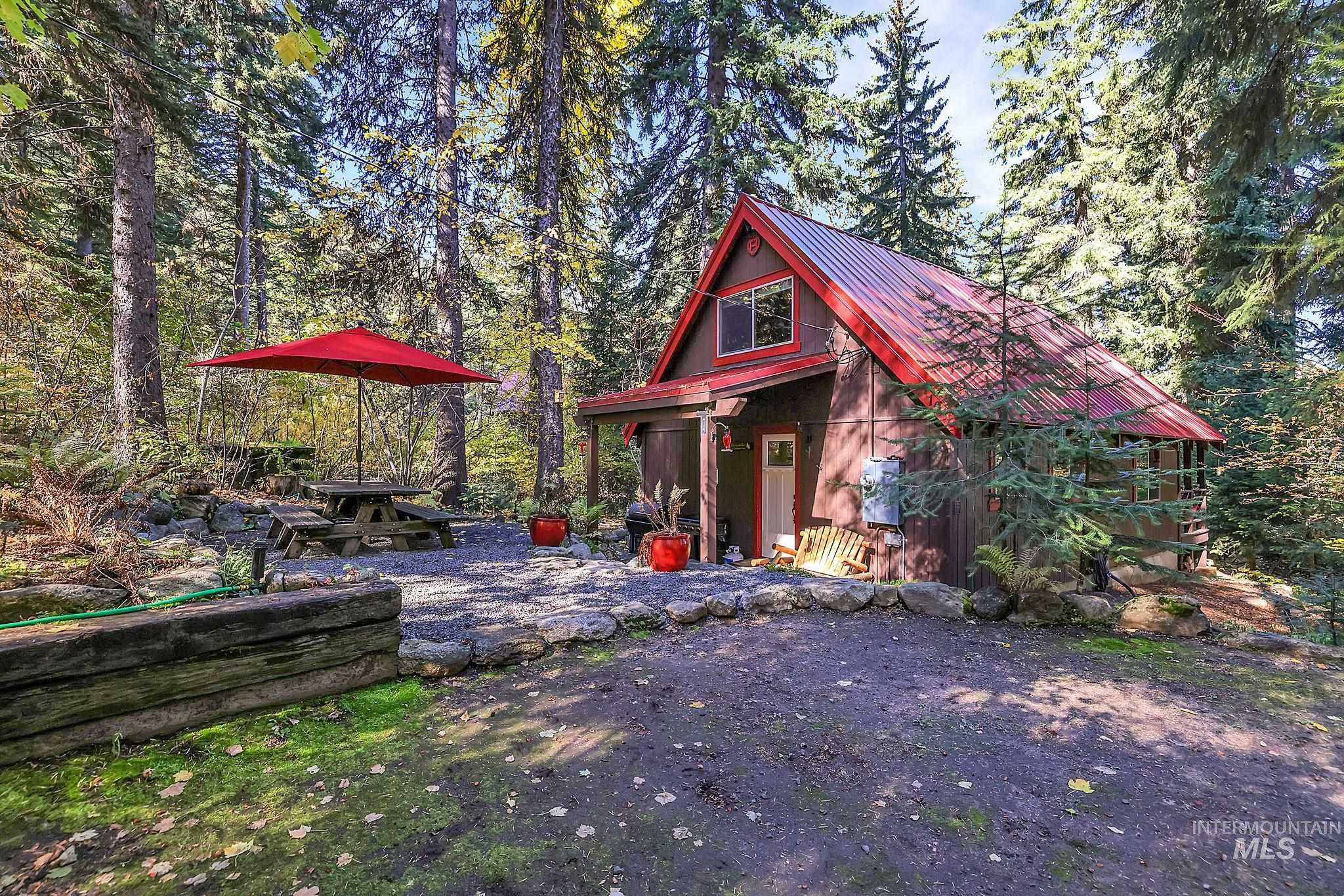 View of Front of Cabin with a forest view