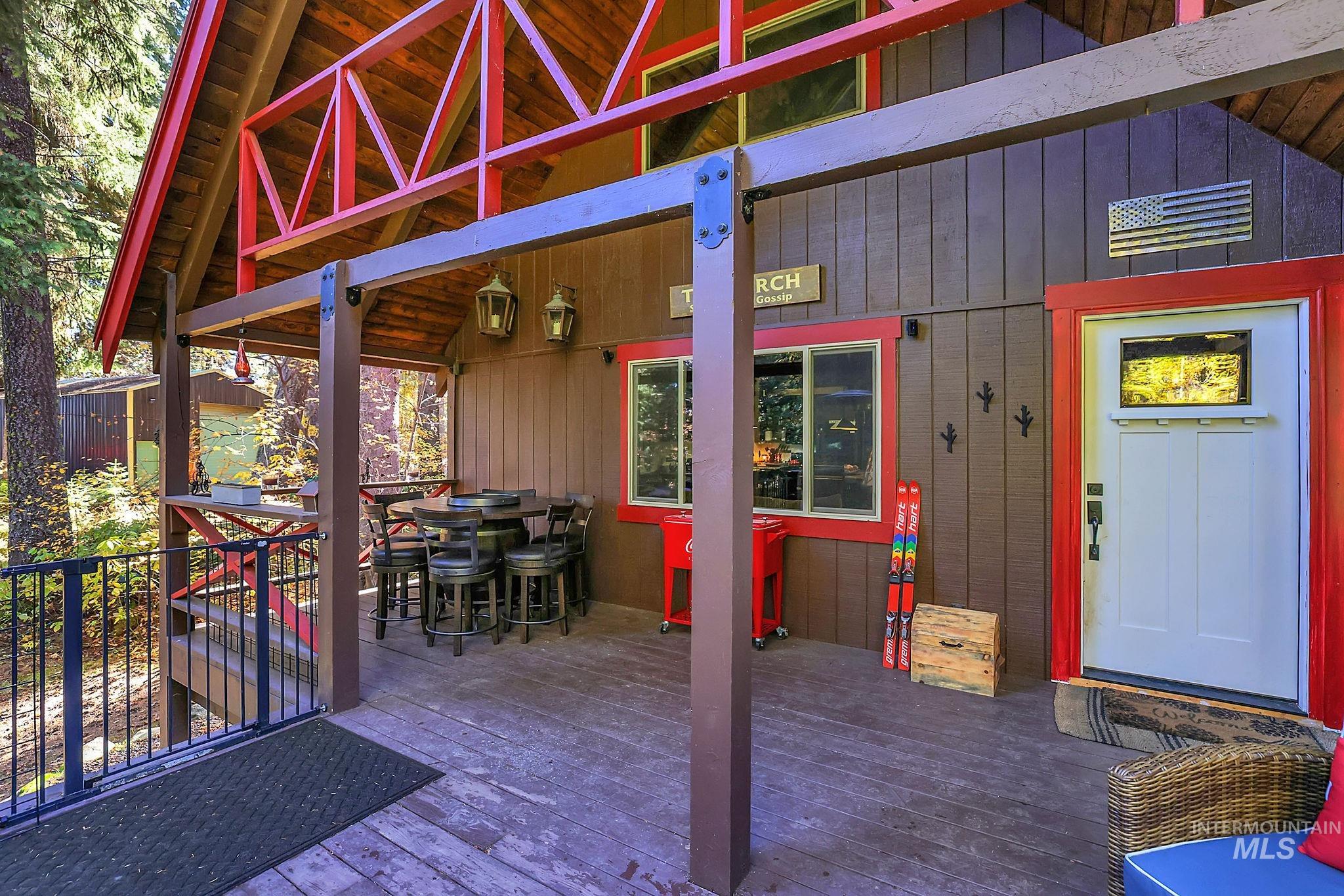 Wooden deck featuring outdoor dining area