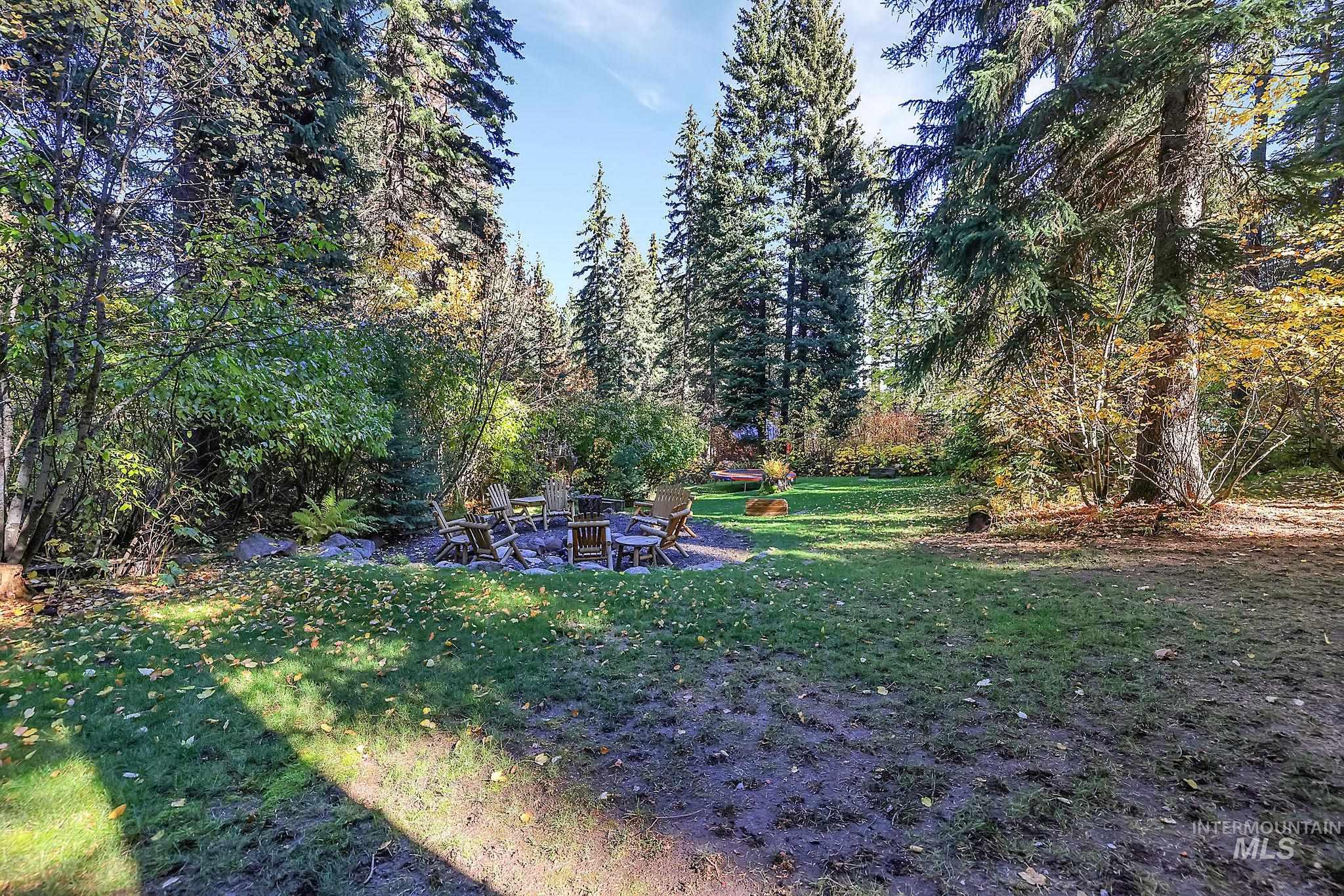 View of green lawn featuring a patio area