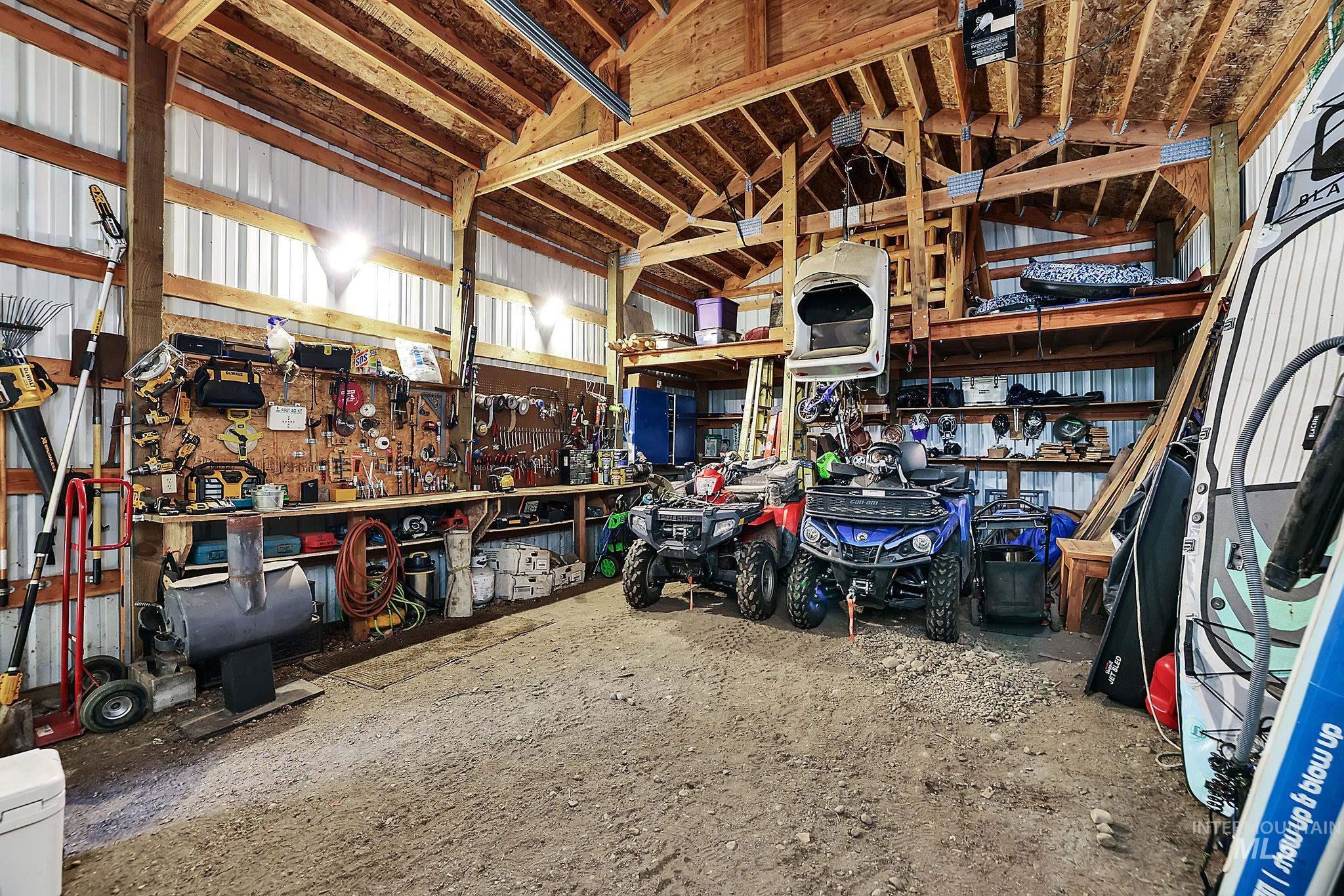 Garage with a workshop area and metal wall
