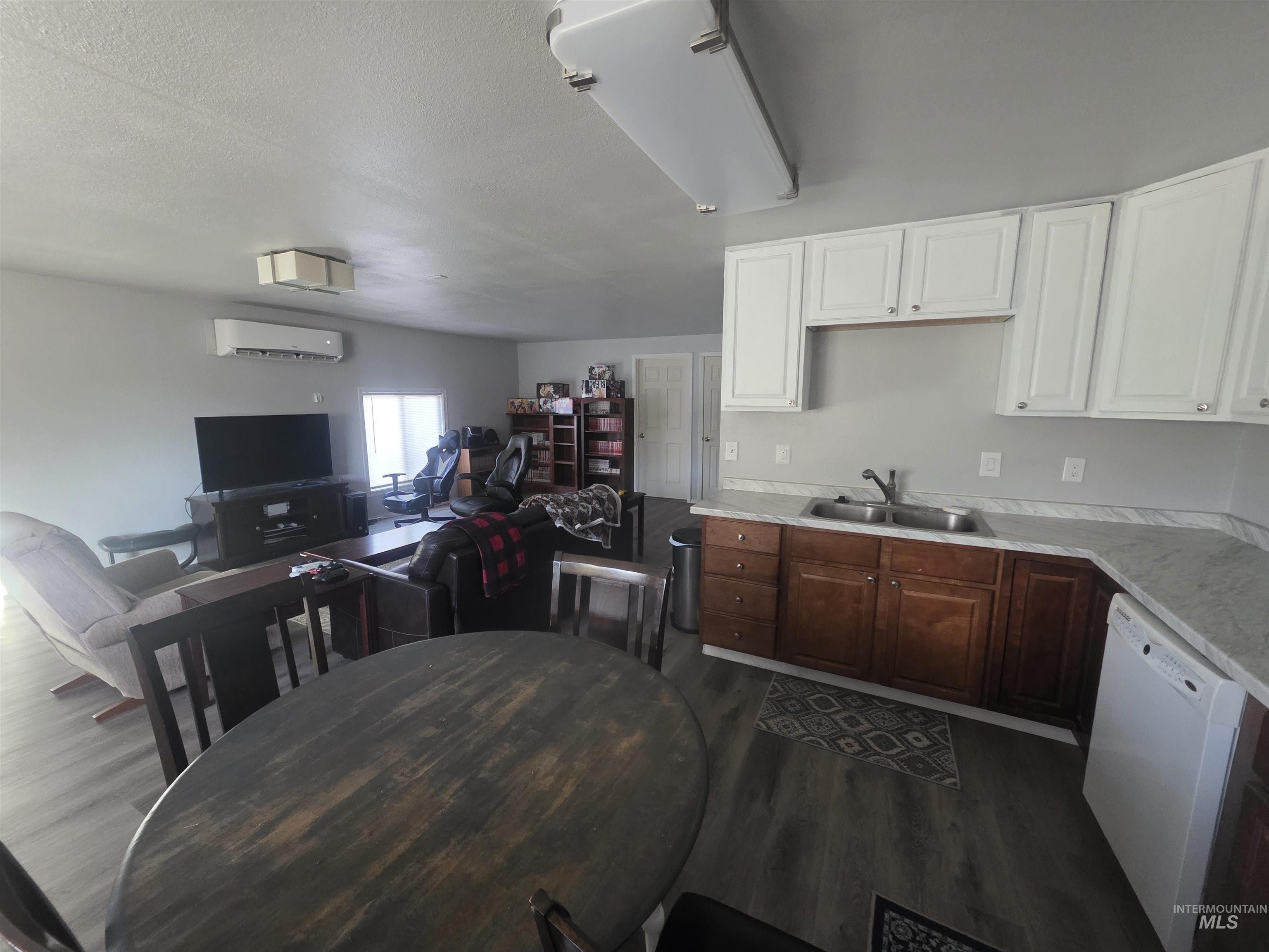 Kitchenette in duplex suite looking into living room.