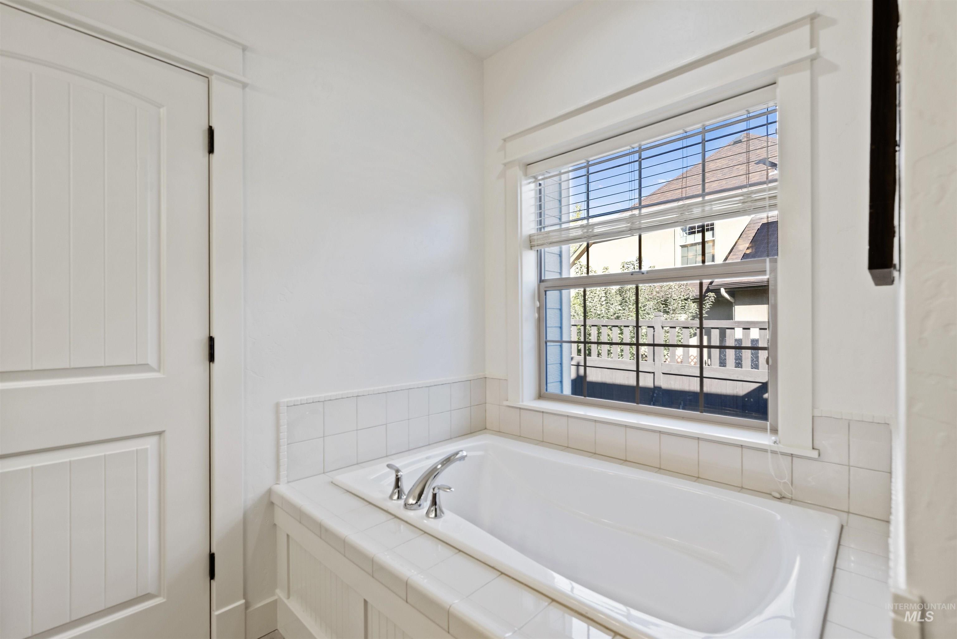 Full bath with a walk in shower.