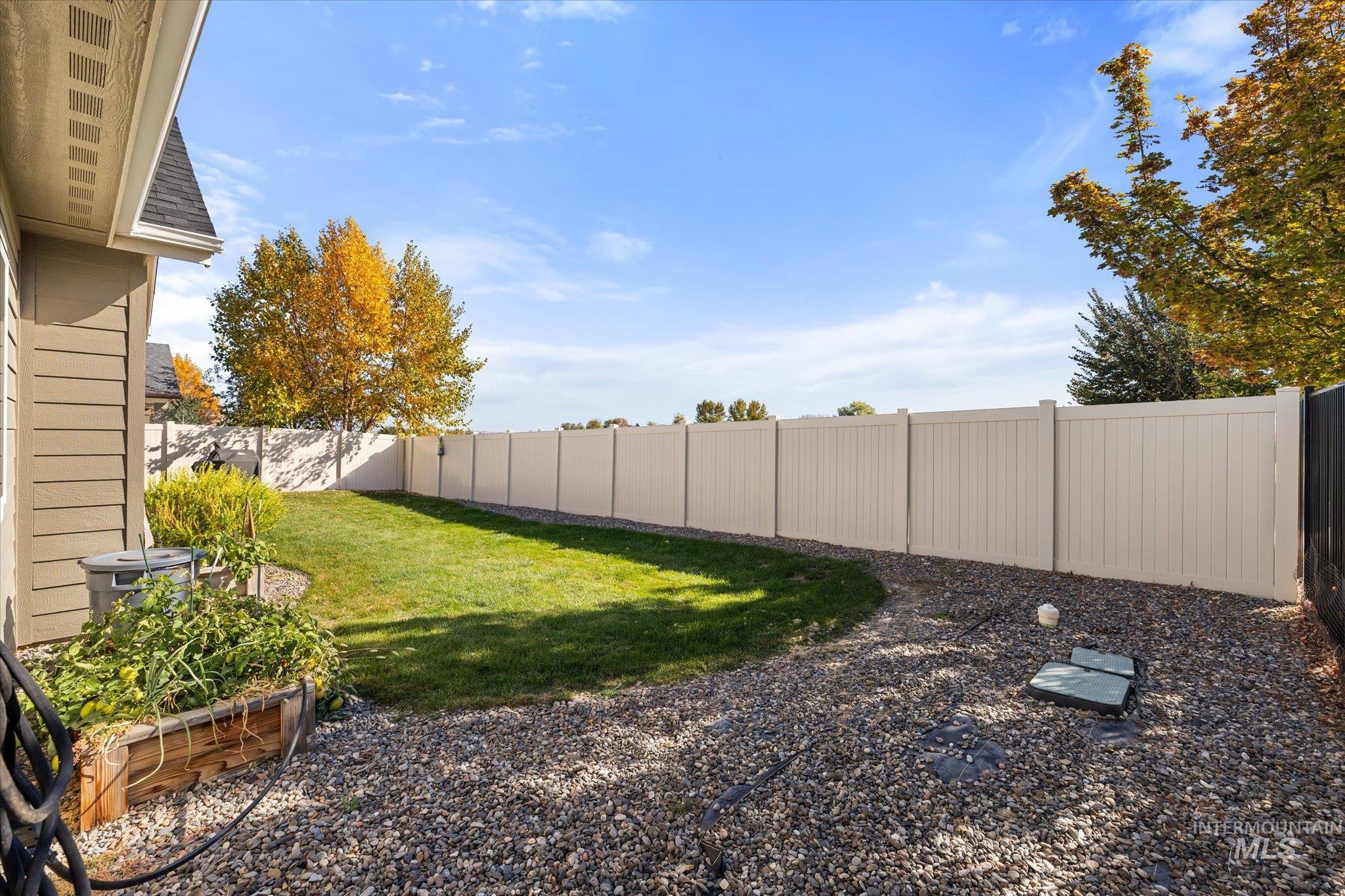 View of fenced backyard