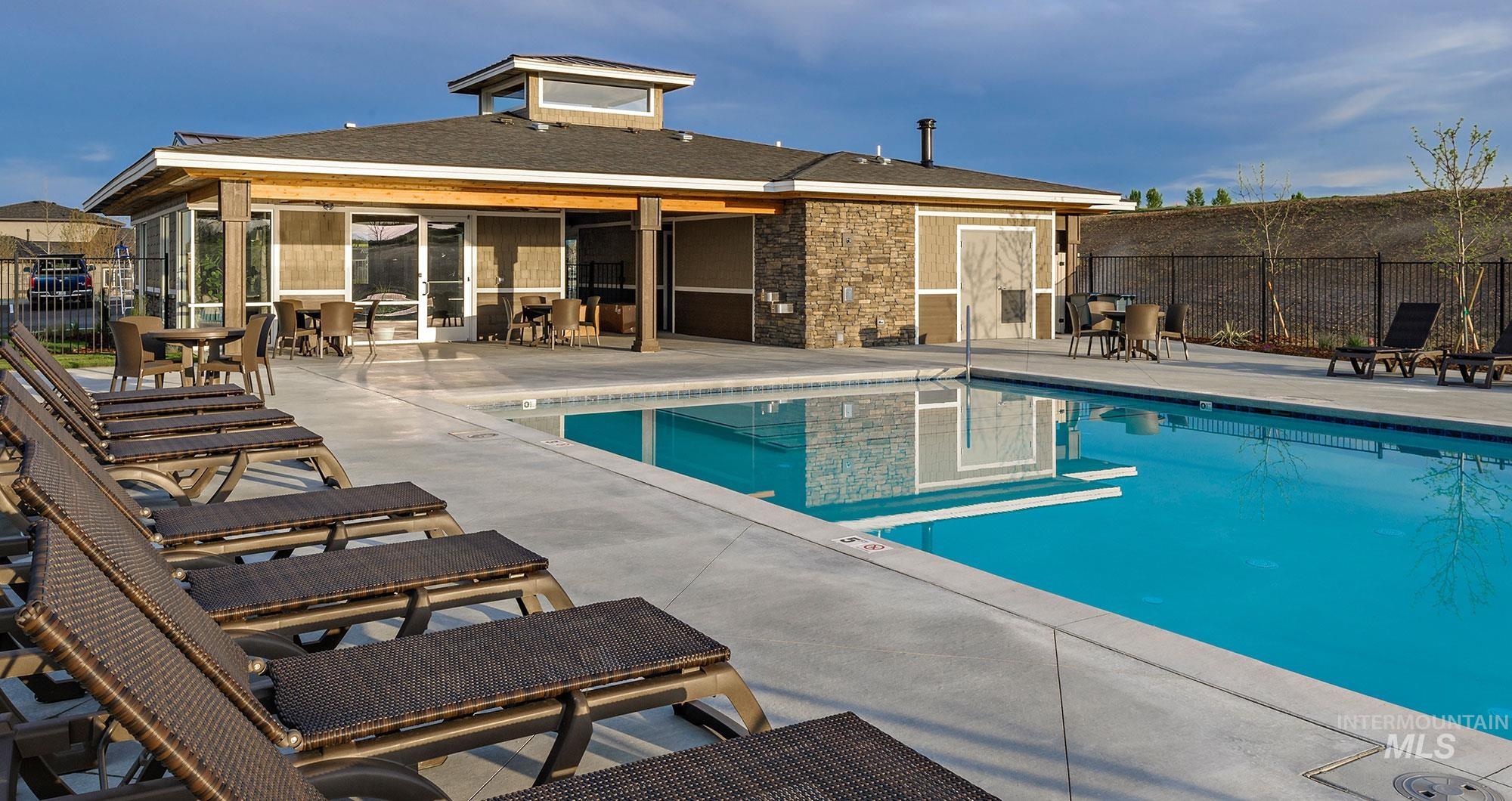 Community pool featuring a patio and a sunroom