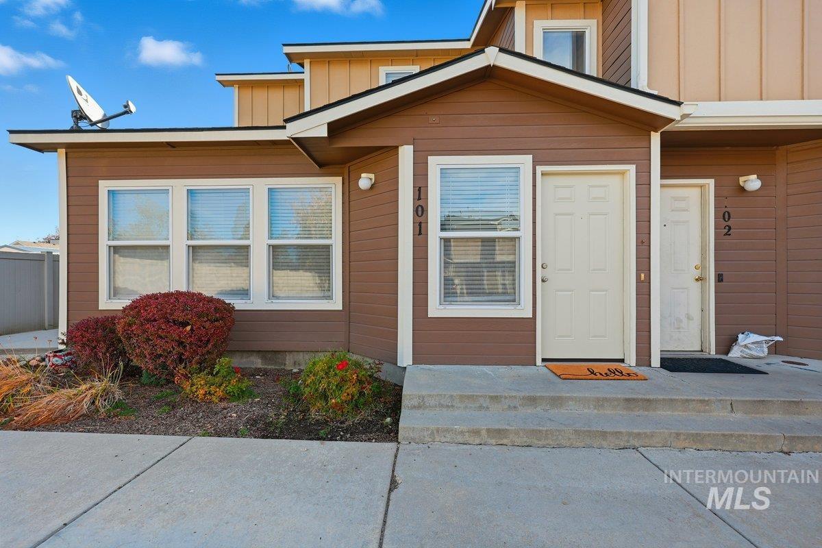 Doorway to property with board and batten siding
