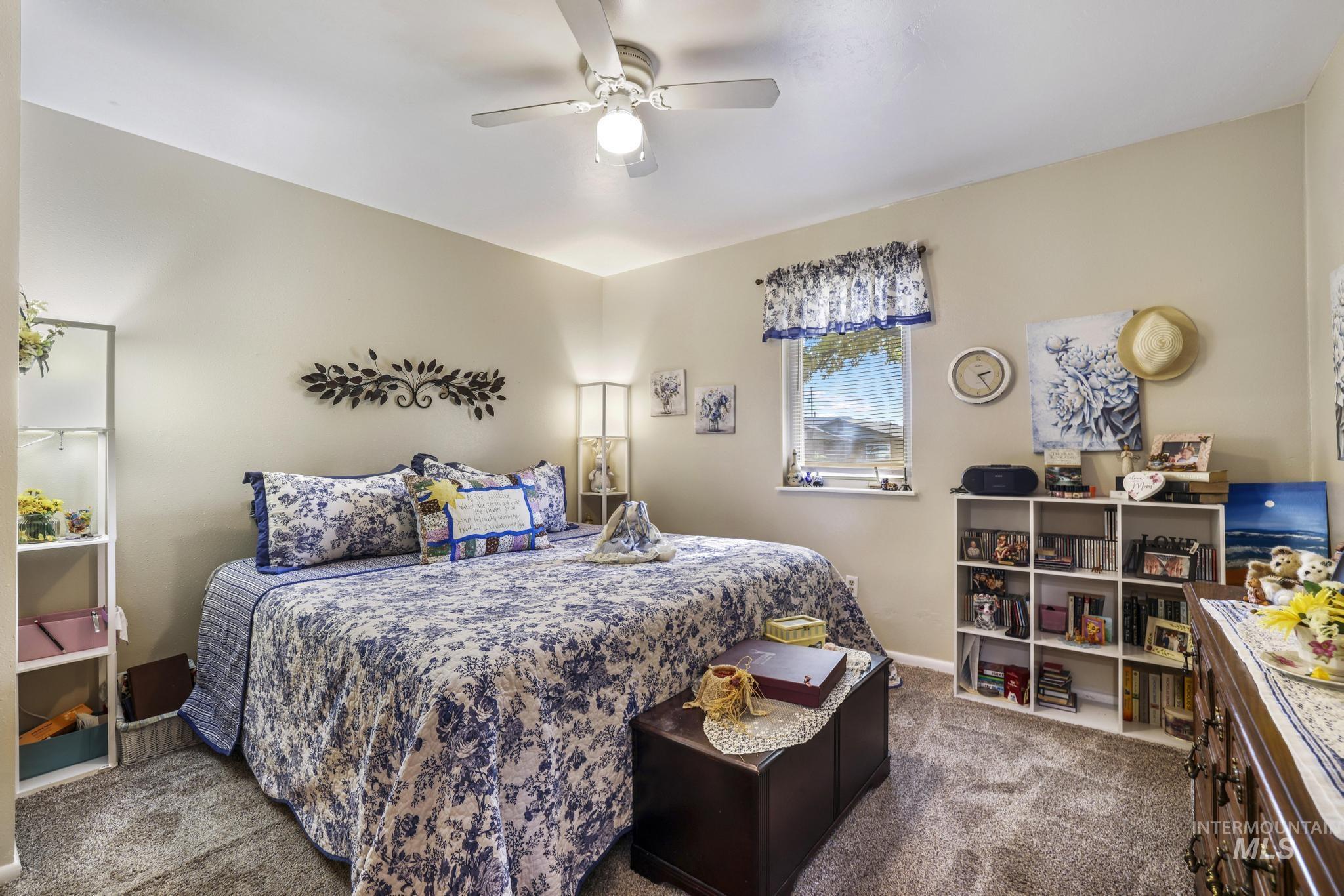 Bedroom with carpet floors and ceiling fan
