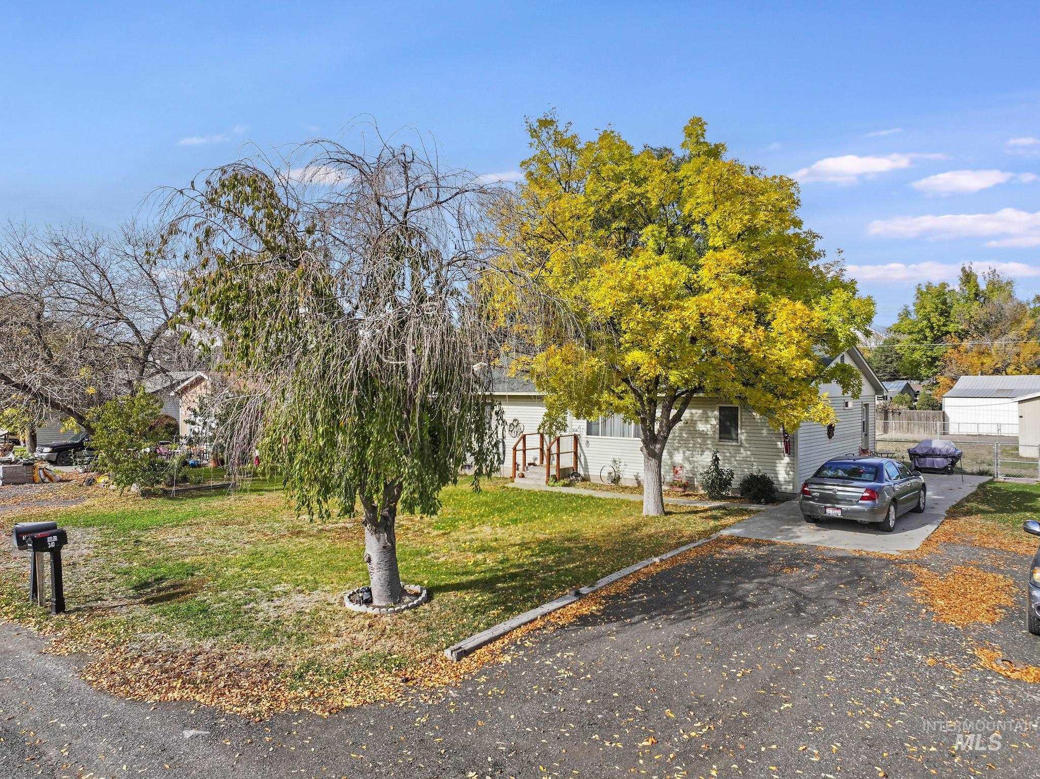 Obstructed view of property with driveway
