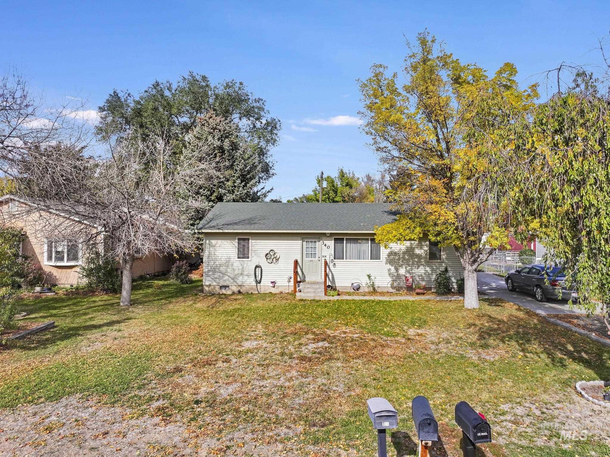 View of front of property with a front yard