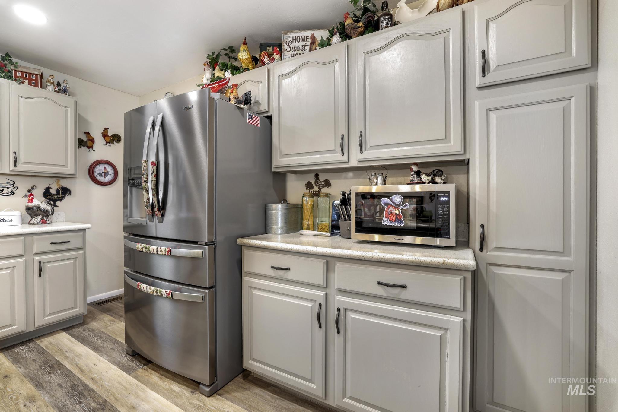 Kitchen with stainless steel appliances and light wood-type flooring